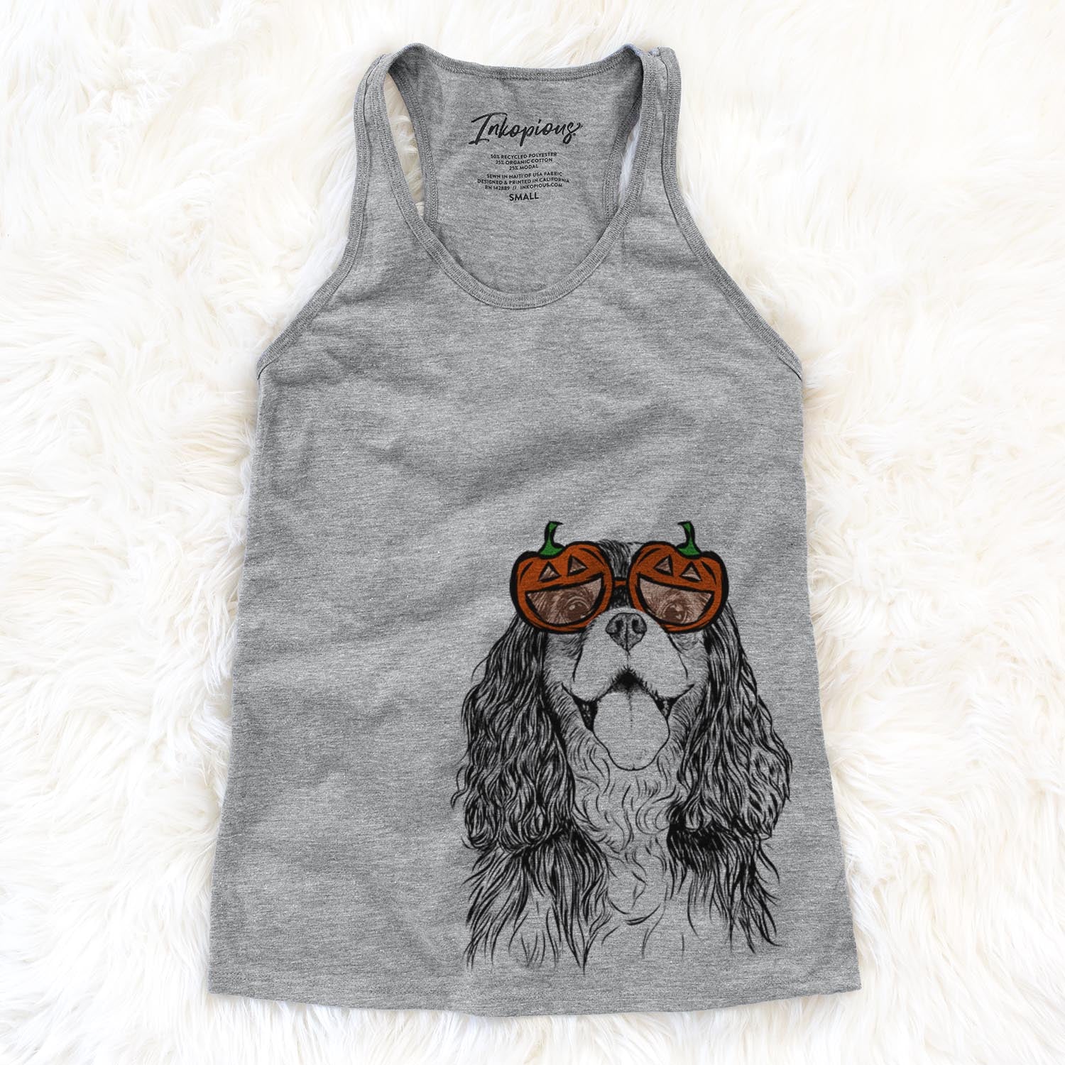 Hand-drawn sketch of Brandy the Cavalier King Charles Spaniel wearing pumpkin glasses on a Grey pumpkin collection