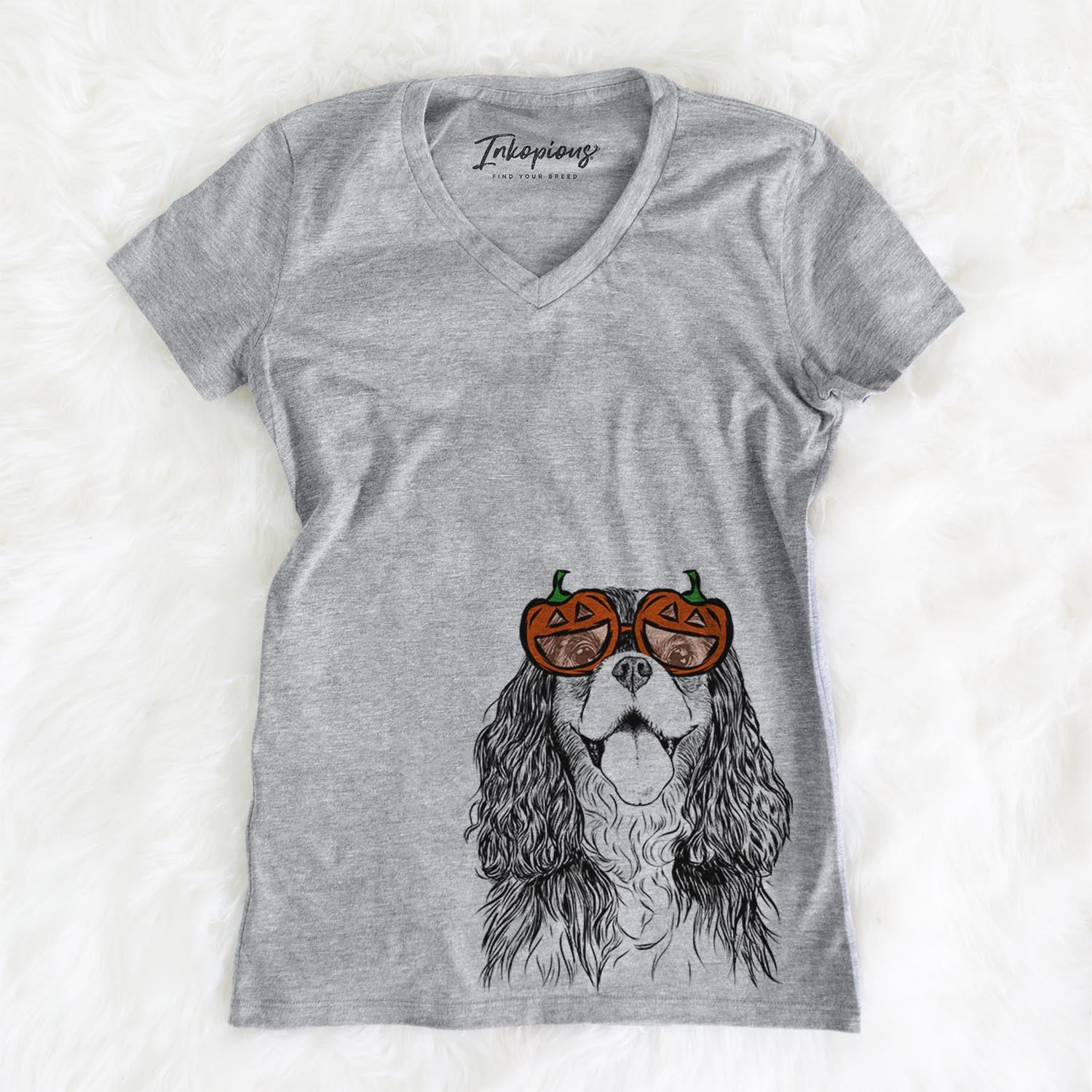 Hand-drawn sketch of Brandy the Cavalier King Charles Spaniel wearing pumpkin glasses on a Grey pumpkin collection, on a hanger