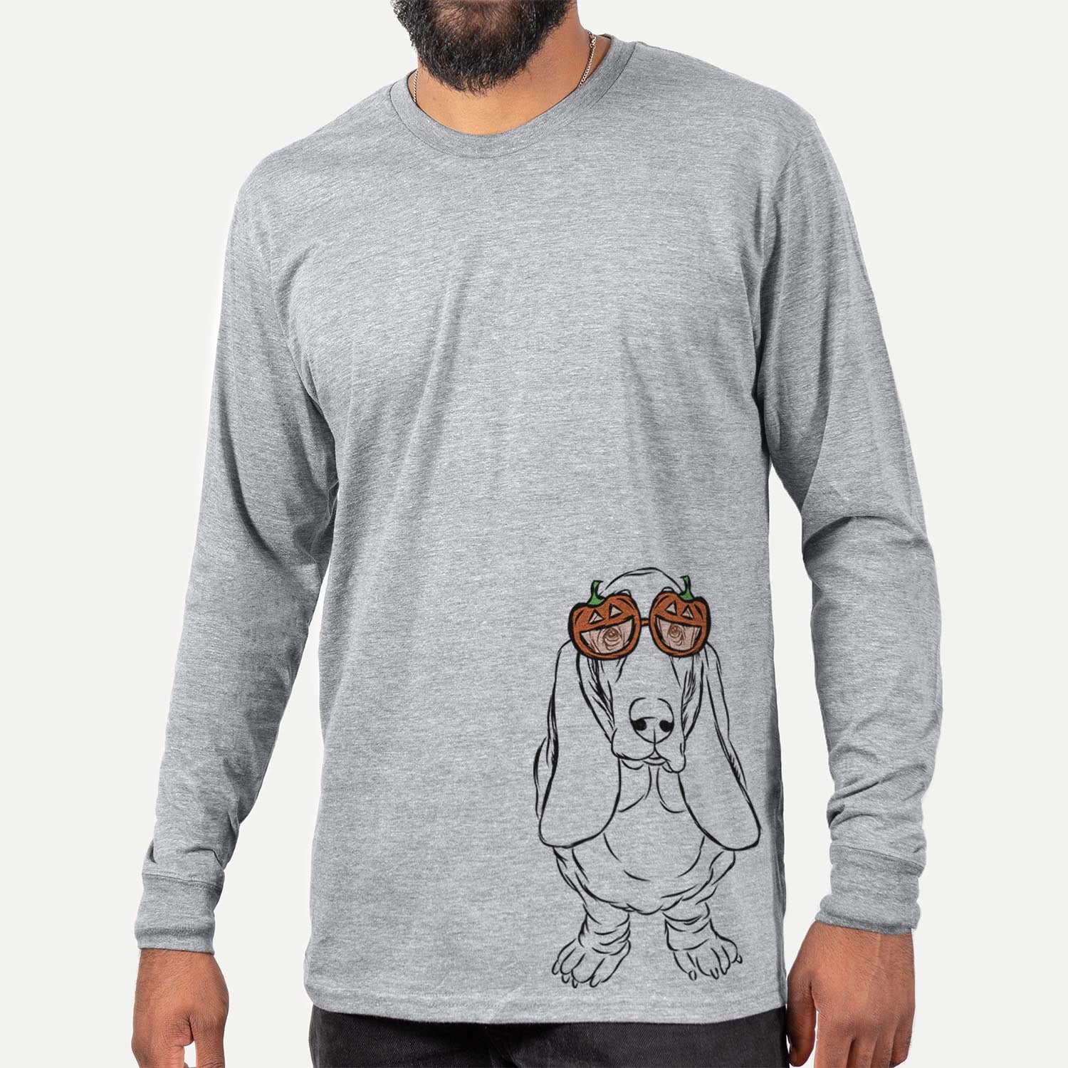Hand-drawn sketch of Charlie the Basset Hound wearing pumpkin glasses on a Grey pumpkin collection, hanging on a wall