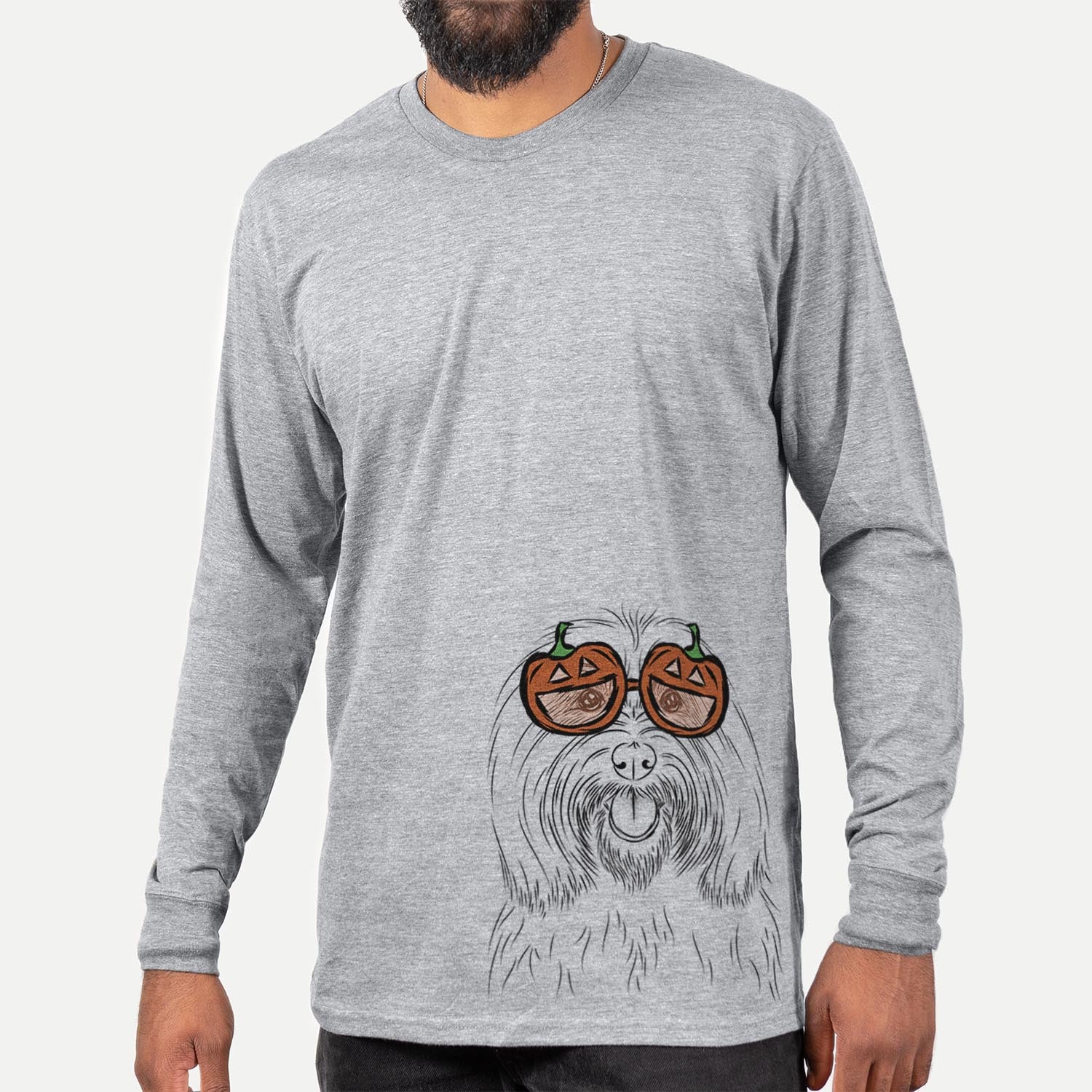 Hand-drawn sketch of Claude the Coton de Tulear wearing pumpkin glasses on a Grey pumpkin collection, hanging on a wall