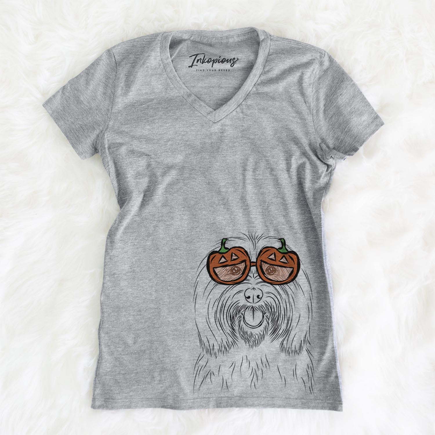 Hand-drawn sketch of Claude the Coton de Tulear wearing pumpkin glasses on a Grey pumpkin collection, on a hanger