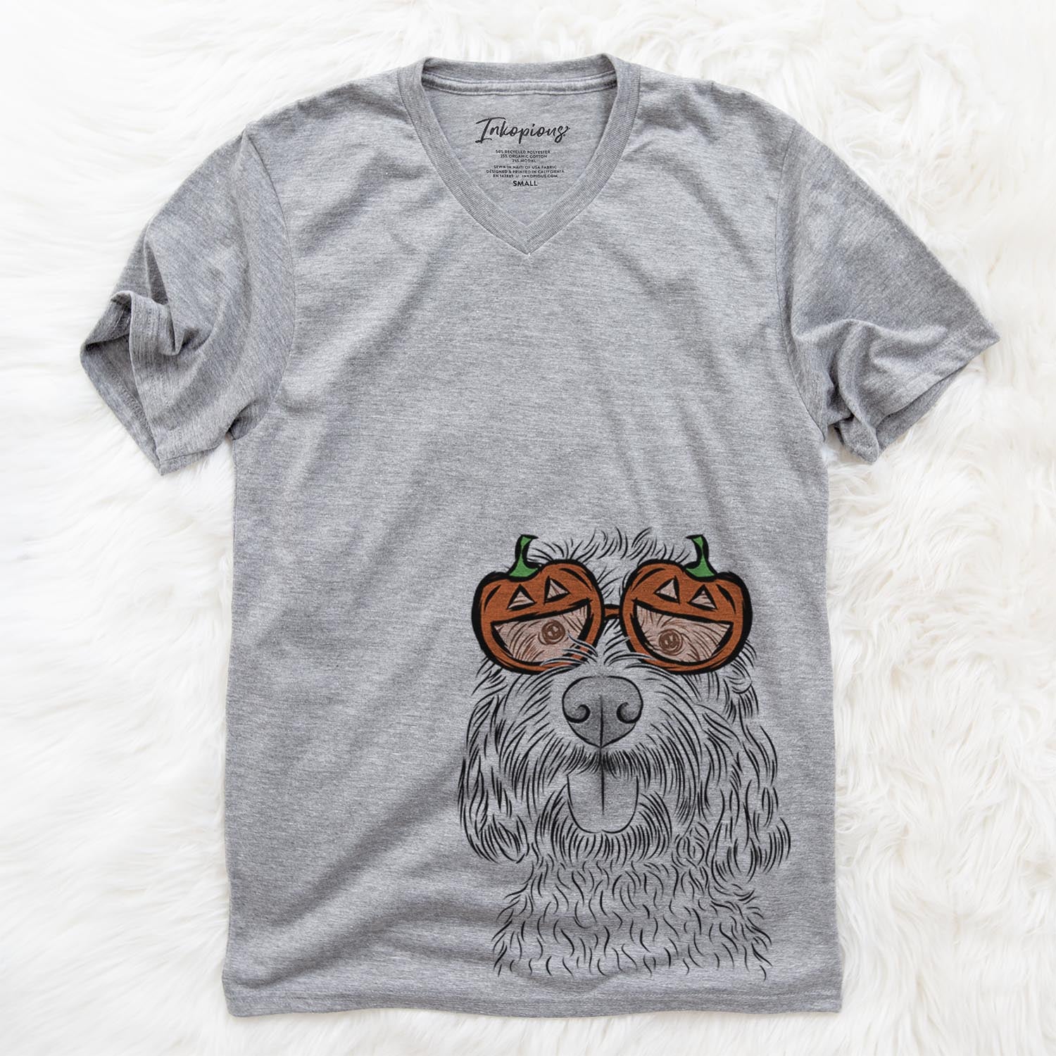 Hand-drawn sketch of Clover the Cockapoo wearing pumpkin glasses on a Grey pumpkin collection