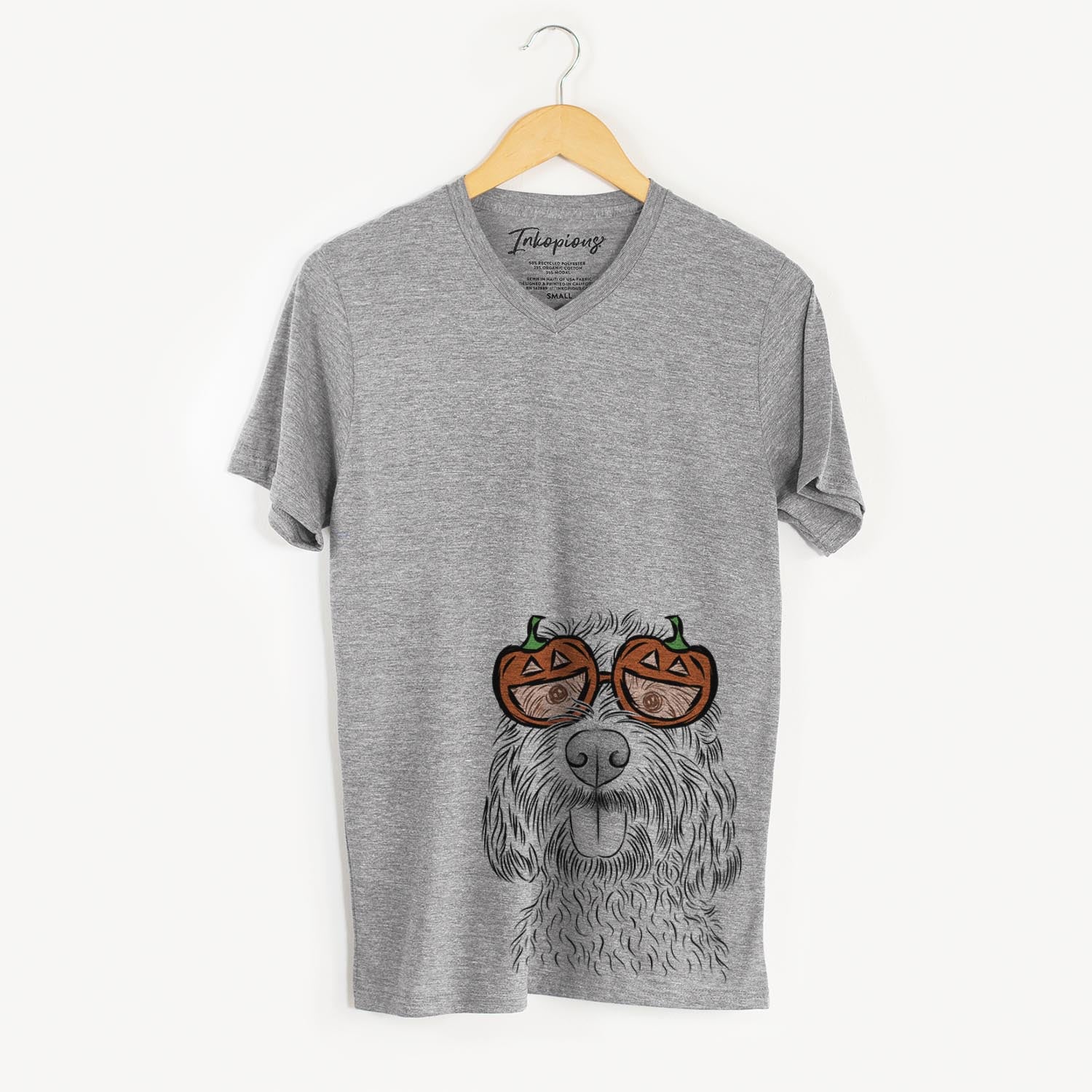 Hand-drawn sketch of Clover the Cockapoo wearing pumpkin glasses on a Grey pumpkin collection