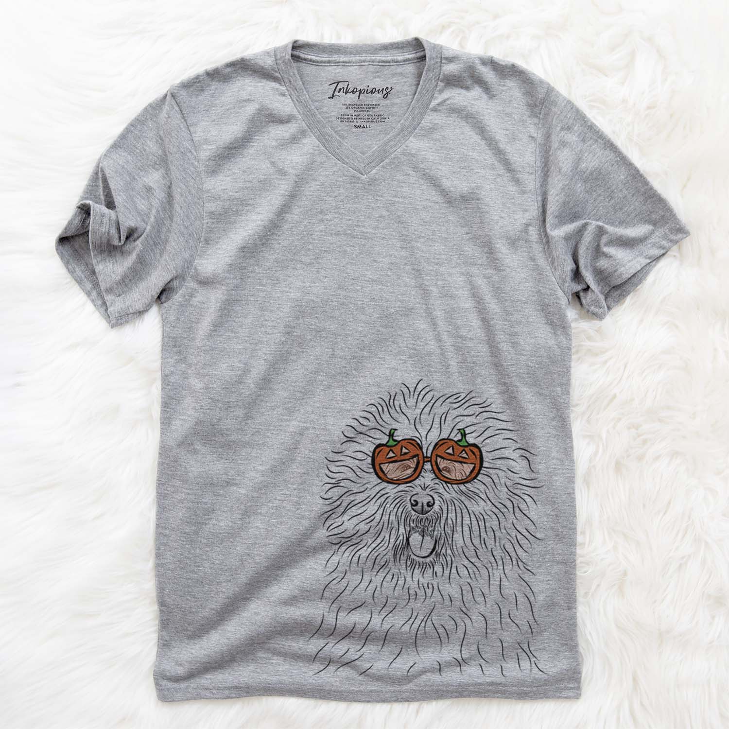 Hand-drawn sketch of Cozie the Old English Sheepdog wearing pumpkin glasses on a Grey pumpkin collection