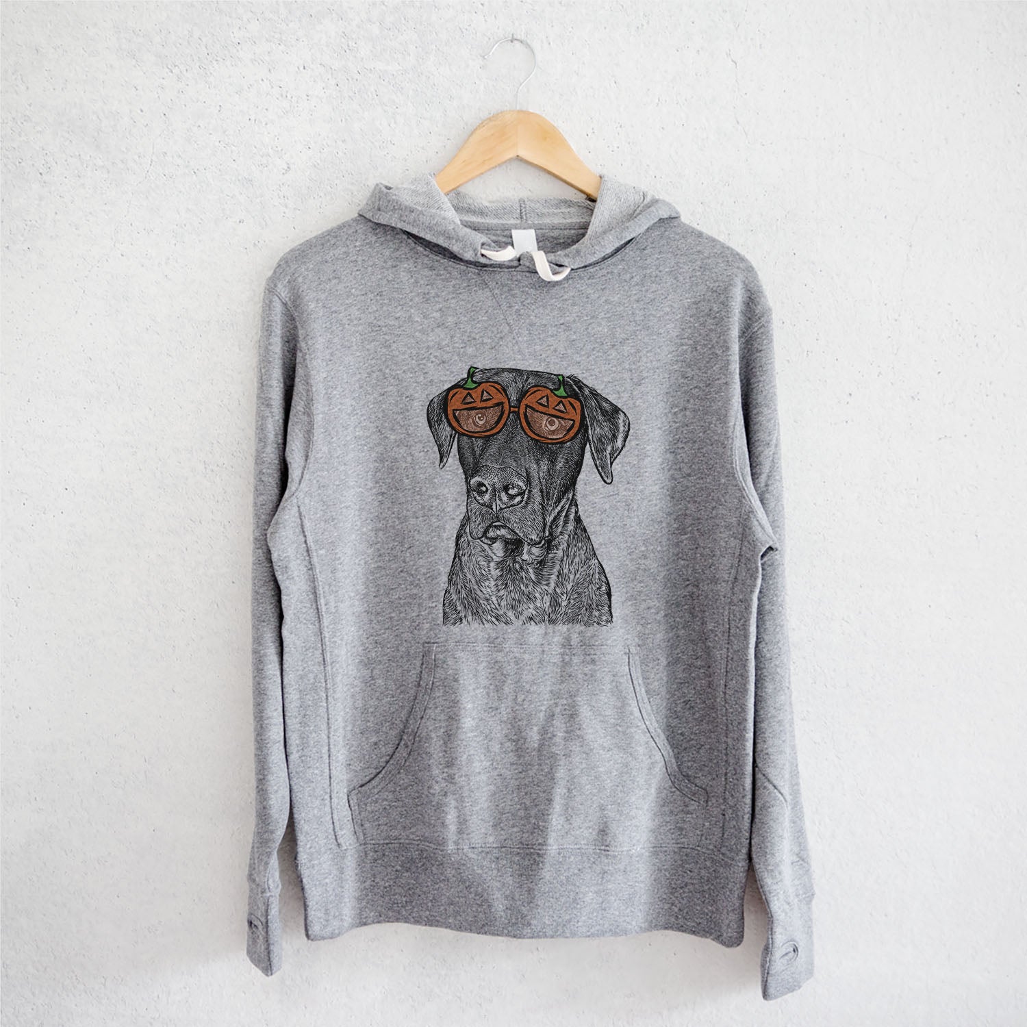 Hand-drawn sketch of David the Boxador wearing pumpkin glasses on a Grey pumpkin collection, on a hanger