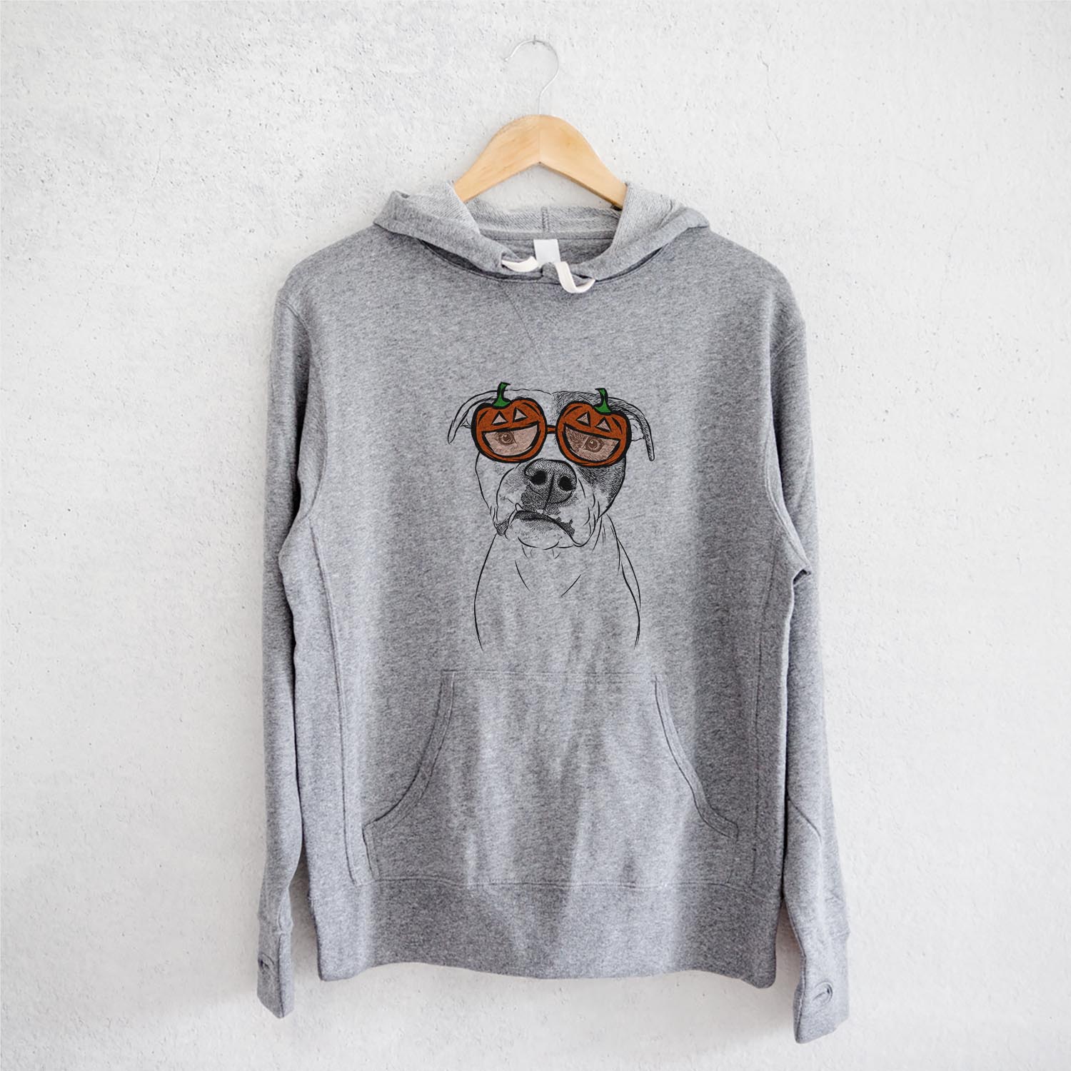 Hand-drawn sketch of Dexter the Pitbull wearing pumpkin glasses on a Dexter Pit pumpkin collection, on a hanger
