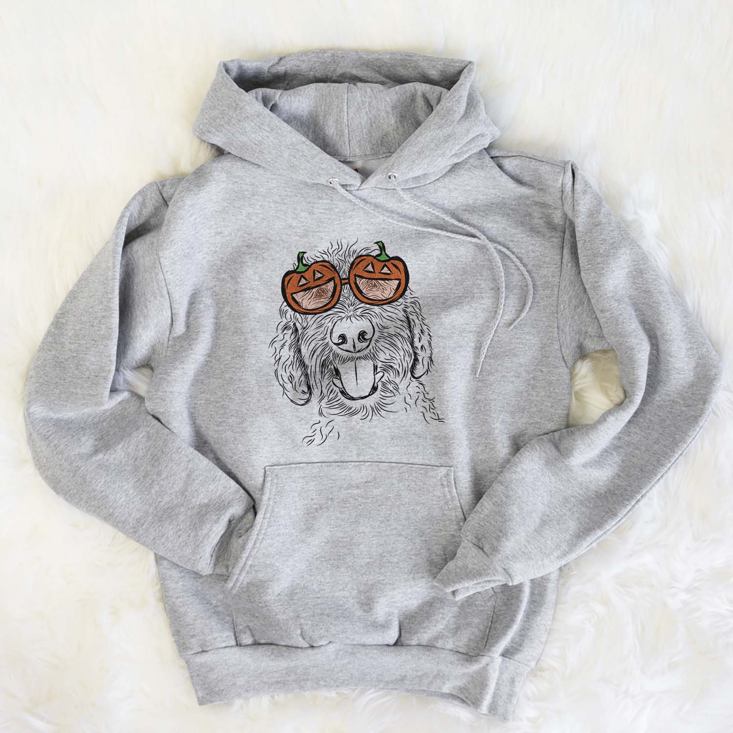 Hand-drawn sketch of Dixie the Doodle wearing pumpkin glasses on a Grey pumpkin collection, flat lay