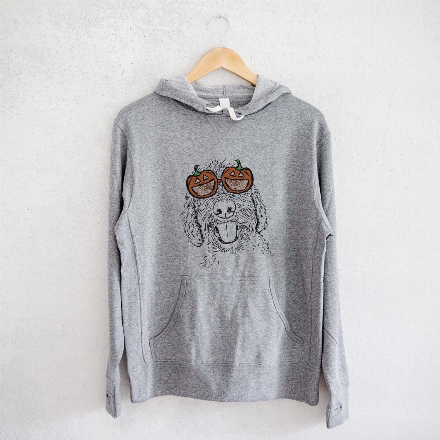 Hand-drawn sketch of Dixie the Doodle wearing pumpkin glasses on a Grey pumpkin collection, on a hanger