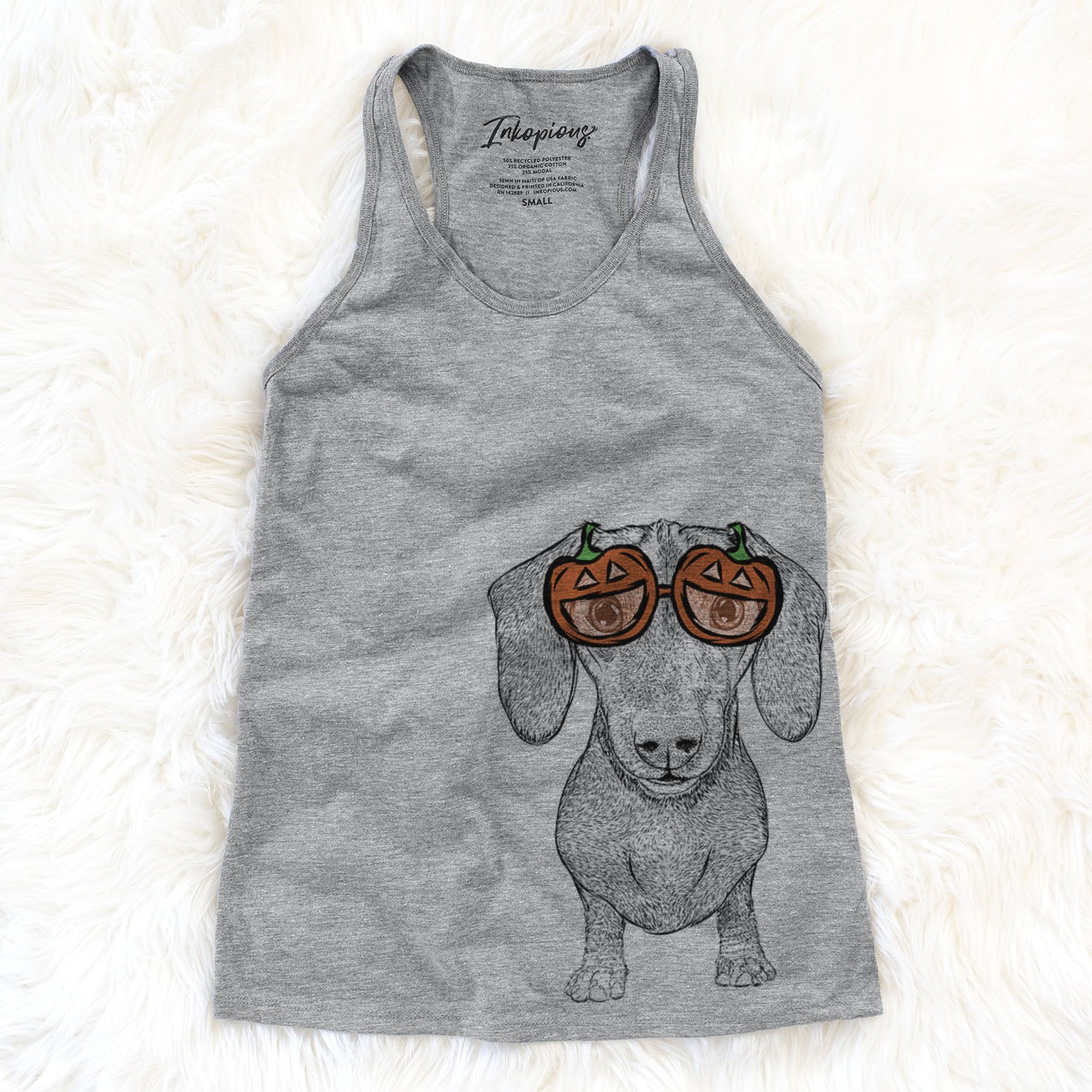 Hand-drawn sketch of Ernie the Mini Dachshund wearing pumpkin glasses on a Grey pumpkin collection