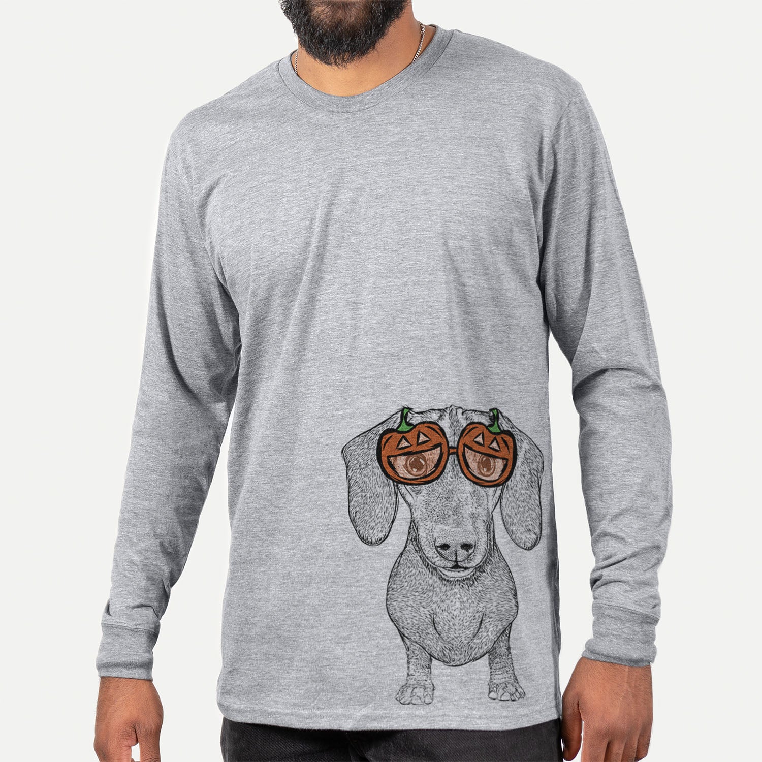 Hand-drawn sketch of Ernie the Mini Dachshund wearing pumpkin glasses on a Grey pumpkin collection, hanging on a wall