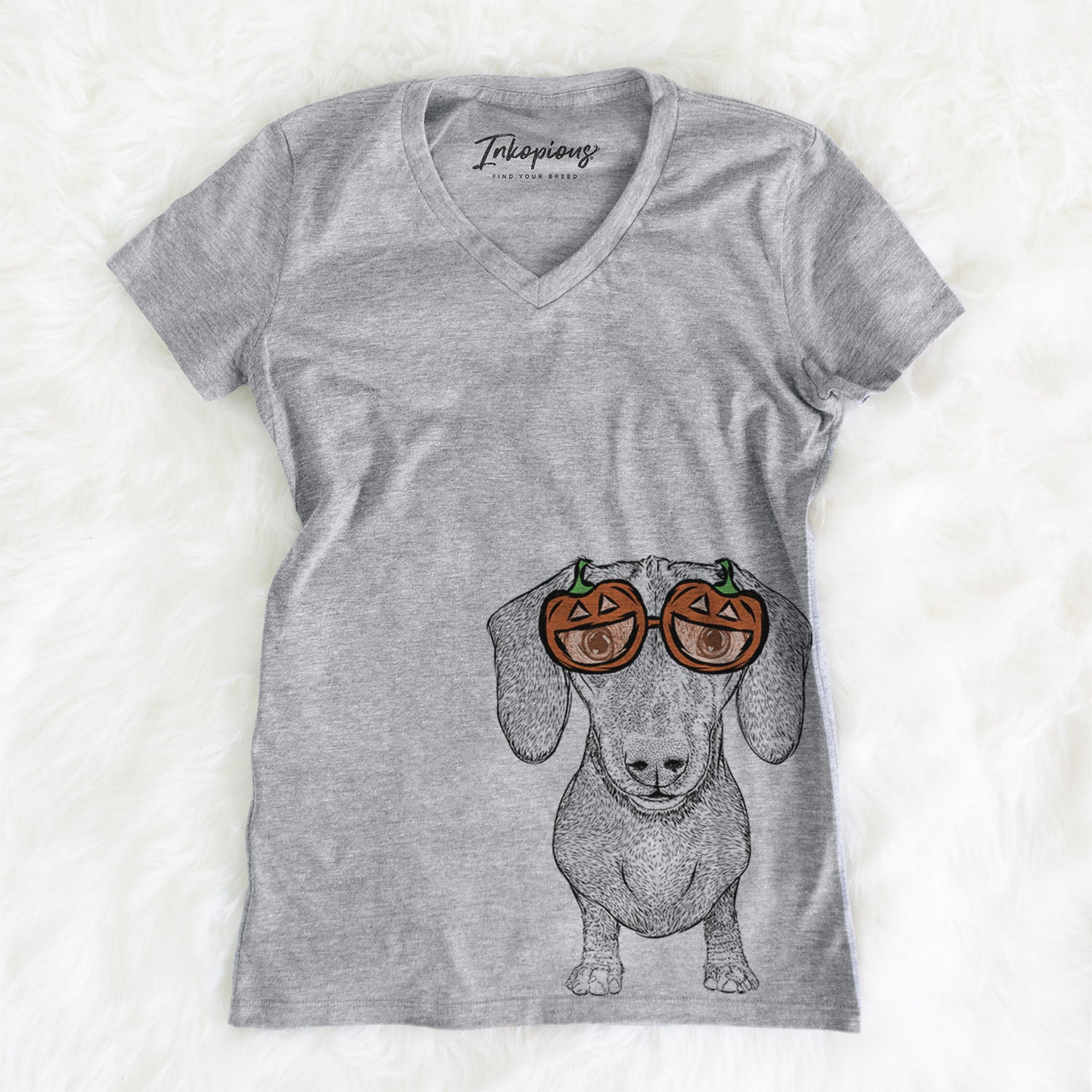 Hand-drawn sketch of Ernie the Mini Dachshund wearing pumpkin glasses on a Grey pumpkin collection, on a hanger