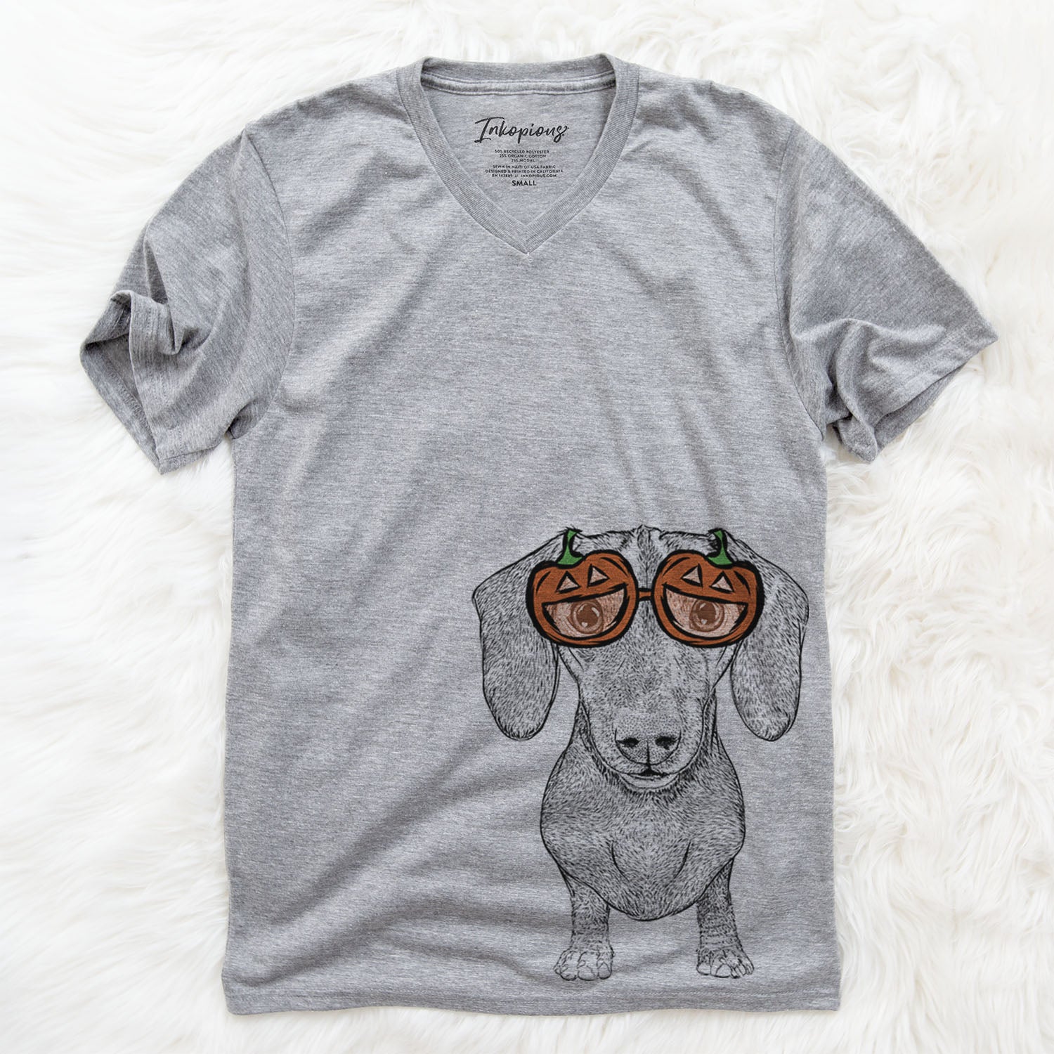 Hand-drawn sketch of Ernie the Mini Dachshund wearing pumpkin glasses on a Grey pumpkin collection