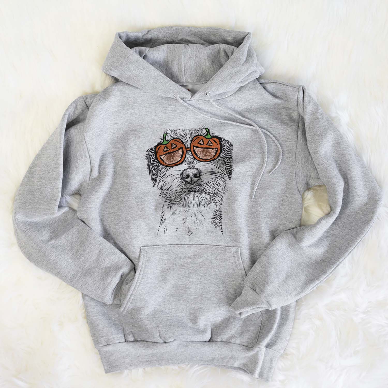 Hand-drawn sketch of Feis the Parson Russell Terrier wearing pumpkin glasses on a Grey pumpkin collection, flat lay
