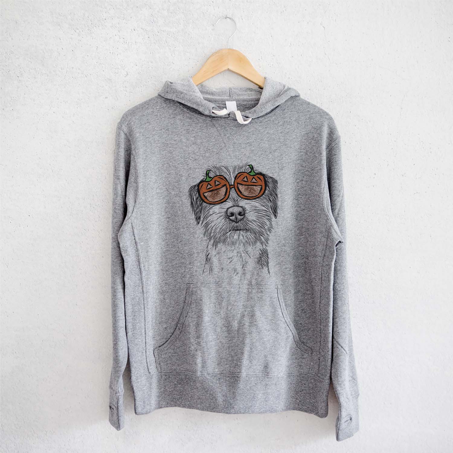 Hand-drawn sketch of Feis the Parson Russell Terrier wearing pumpkin glasses on a Grey pumpkin collection, on a hanger