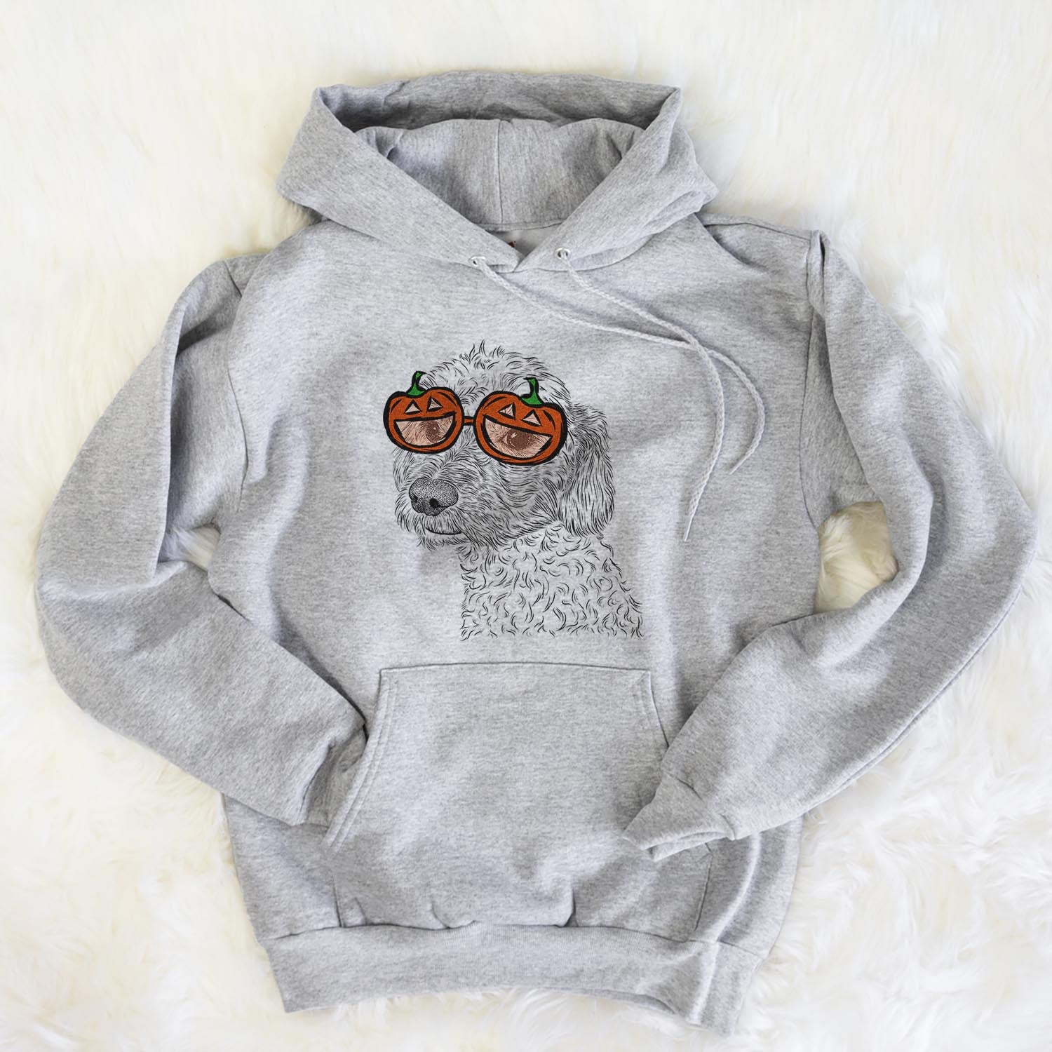Hand-drawn sketch of Georgie Boy the Mixed Breed wearing pumpkin glasses on a Grey pumpkin collection, flat lay