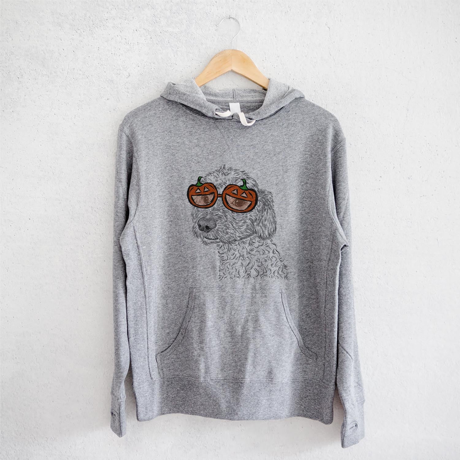 Hand-drawn sketch of Georgie Boy the Mixed Breed wearing pumpkin glasses on a Grey pumpkin collection, on a hanger