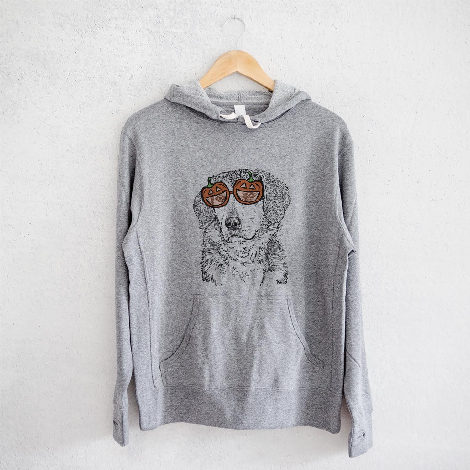 Hand-drawn sketch of Gunner the Mixed Breed wearing pumpkin glasses on a Gunner Mix pumpkin collection, on a hanger
