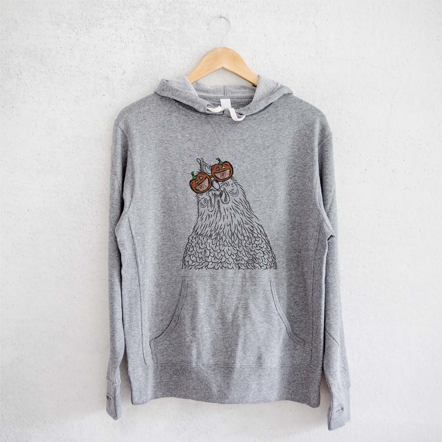 Hand-drawn sketch of Henrietta the Chicken wearing pumpkin glasses on a Grey pumpkin collection, on a hanger