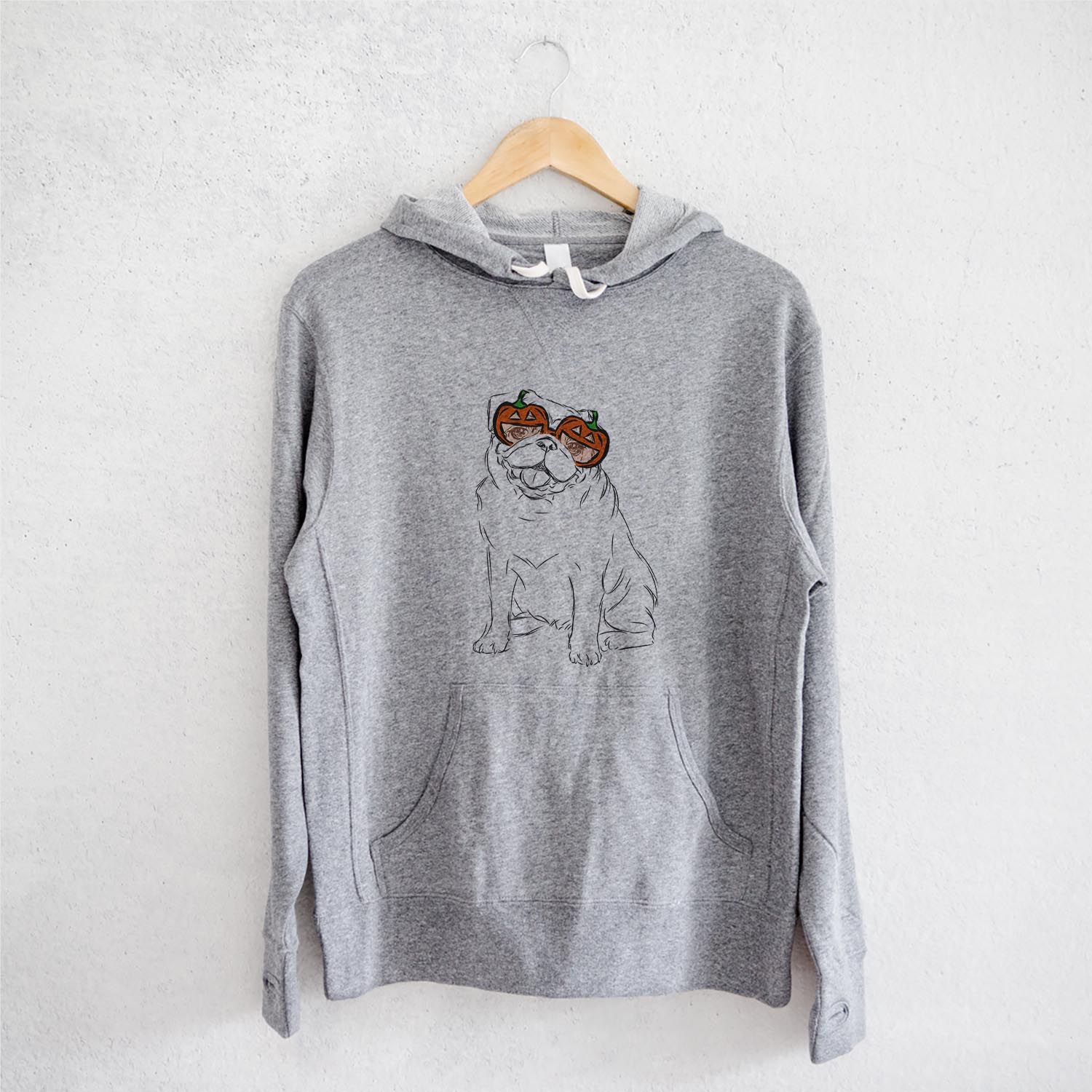 Hand-drawn sketch of Higgins the Pug wearing pumpkin glasses on a Grey pumpkin collection, on a hanger