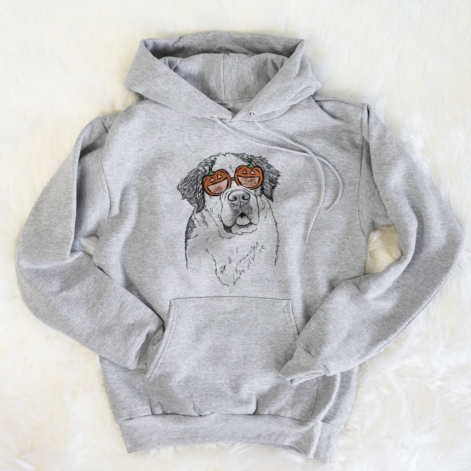 Hand-drawn sketch of Hook the Saint Bernard wearing pumpkin glasses on a Grey pumpkin collection, flat lay