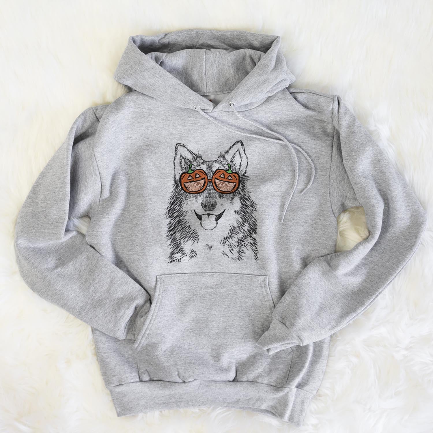 Hand-drawn sketch of Iben the Utonagan wearing pumpkin glasses on a Grey pumpkin collection, flat lay