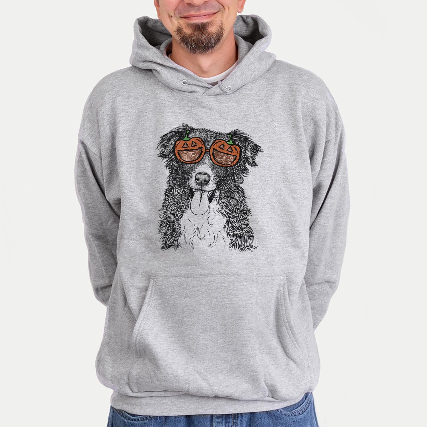 Hand-drawn sketch of Indi the Border Collie wearing pumpkin glasses on a Grey pumpkin collection, hanging on a wall