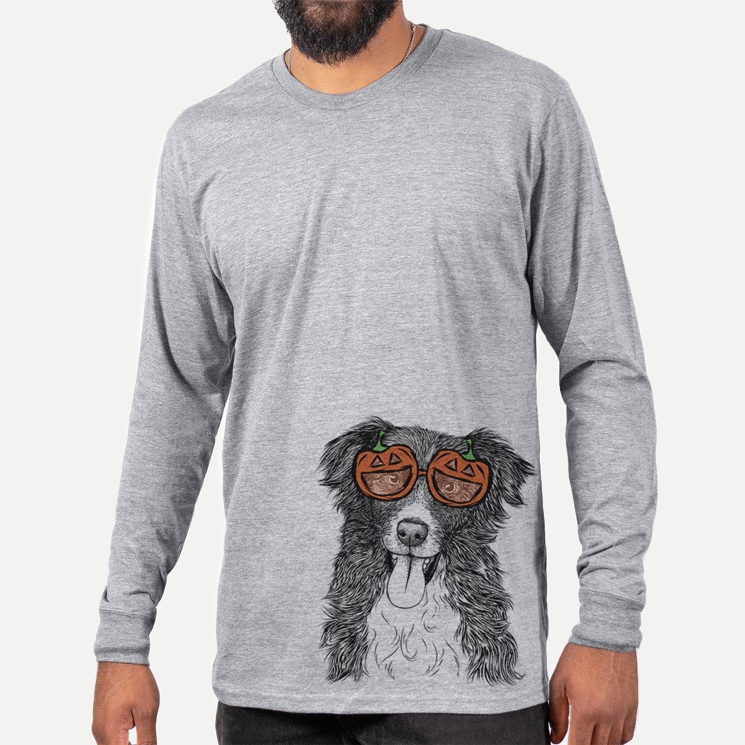 Hand-drawn sketch of Indi the Border Collie wearing pumpkin glasses on a Grey pumpkin collection, hanging on a wall