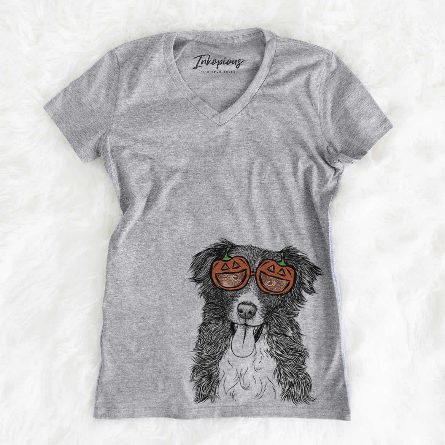 Hand-drawn sketch of Indi the Border Collie wearing pumpkin glasses on a Grey pumpkin collection, on a hanger