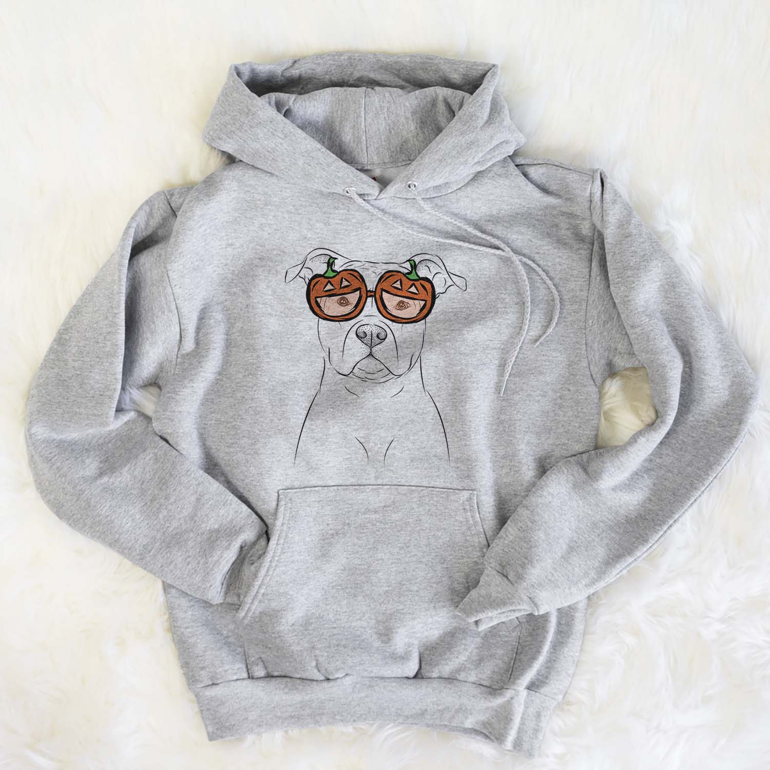 Hand-drawn sketch of Jethro the American Staffordshire Terrier wearing pumpkin glasses on a Grey pumpkin collection, flat lay