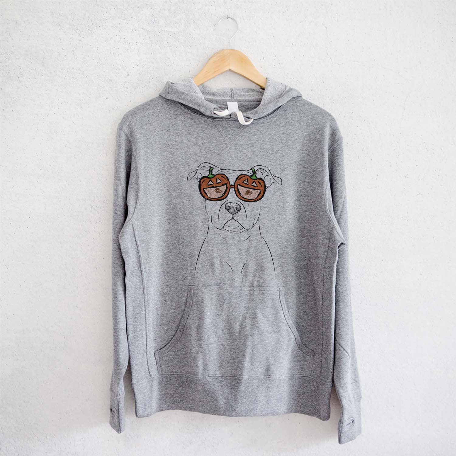 Hand-drawn sketch of Jethro the American Staffordshire Terrier wearing pumpkin glasses on a Grey pumpkin collection, on a hanger