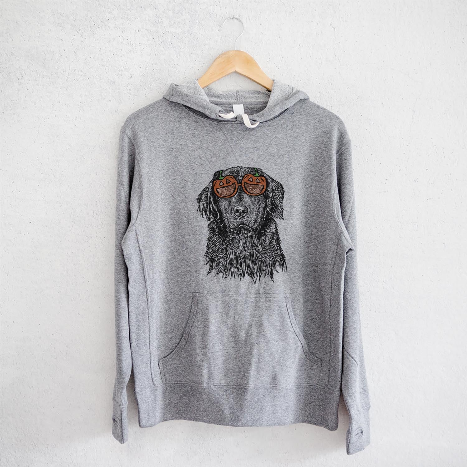 Hand-drawn sketch of Jinx the Newfoundland wearing pumpkin glasses on a Grey pumpkin collection, on a hanger