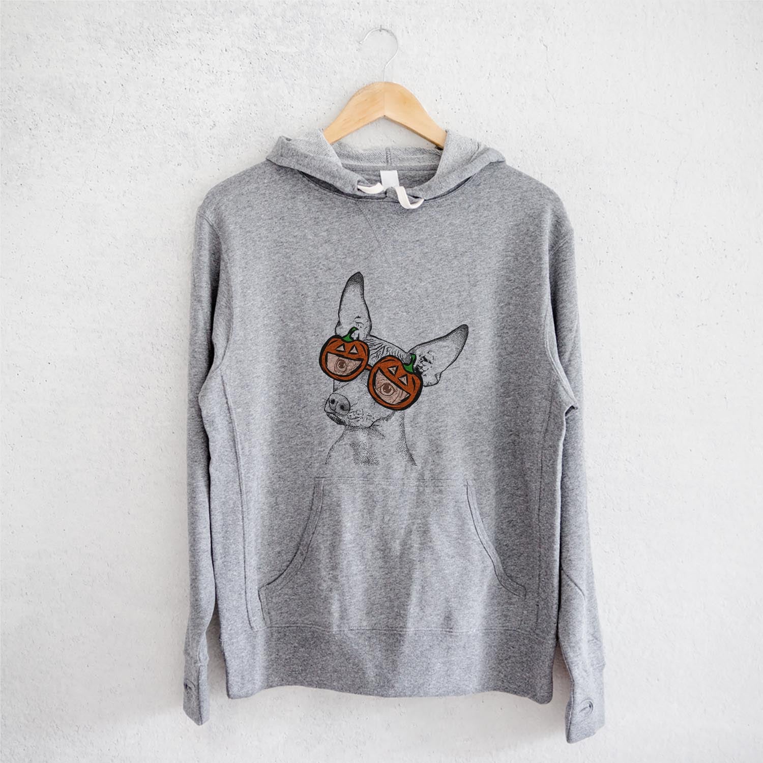 Hand-drawn sketch of Kahlo the Xoloitzcuintli wearing pumpkin glasses on a Grey pumpkin collection, on a hanger