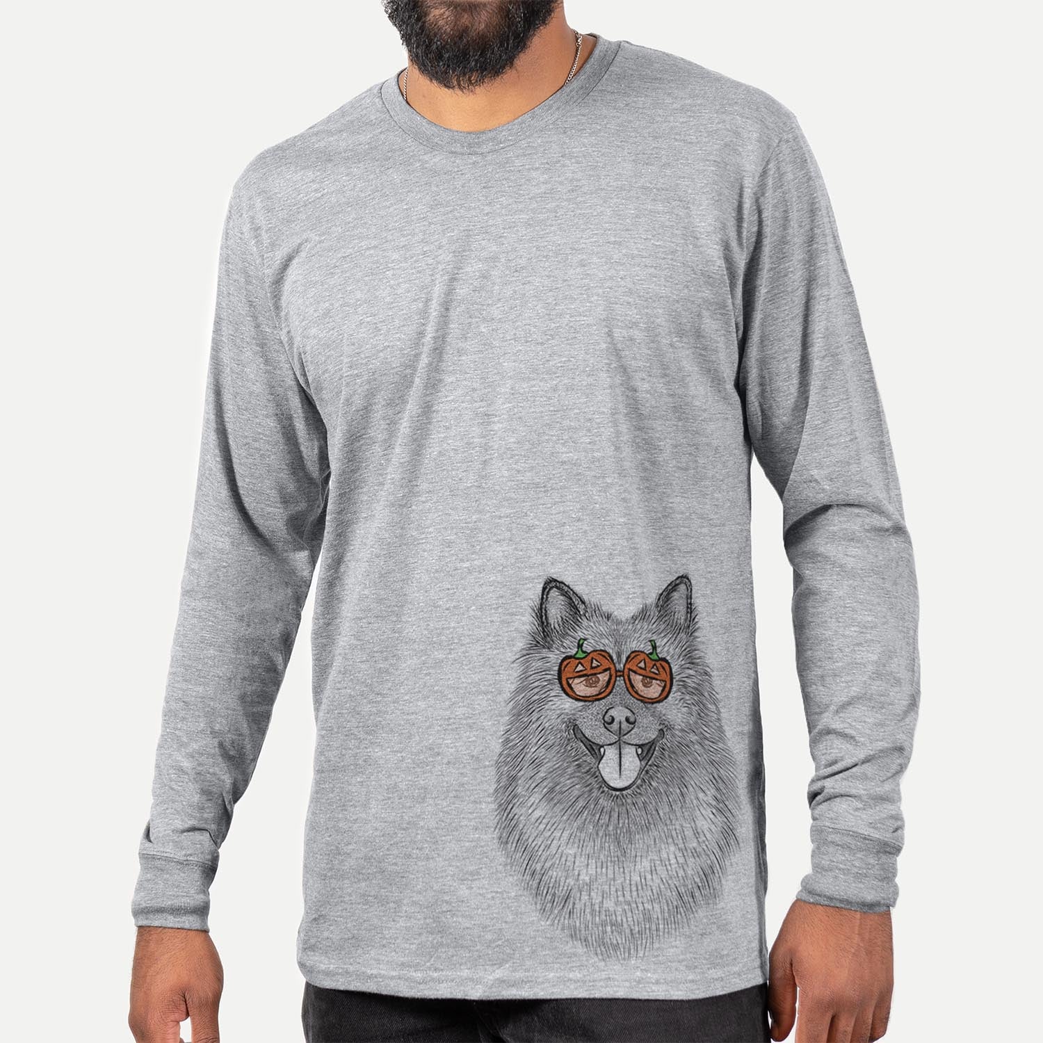 Hand-drawn sketch of Kai the Keeshond wearing pumpkin glasses on a Grey pumpkin collection, hanging on a wall