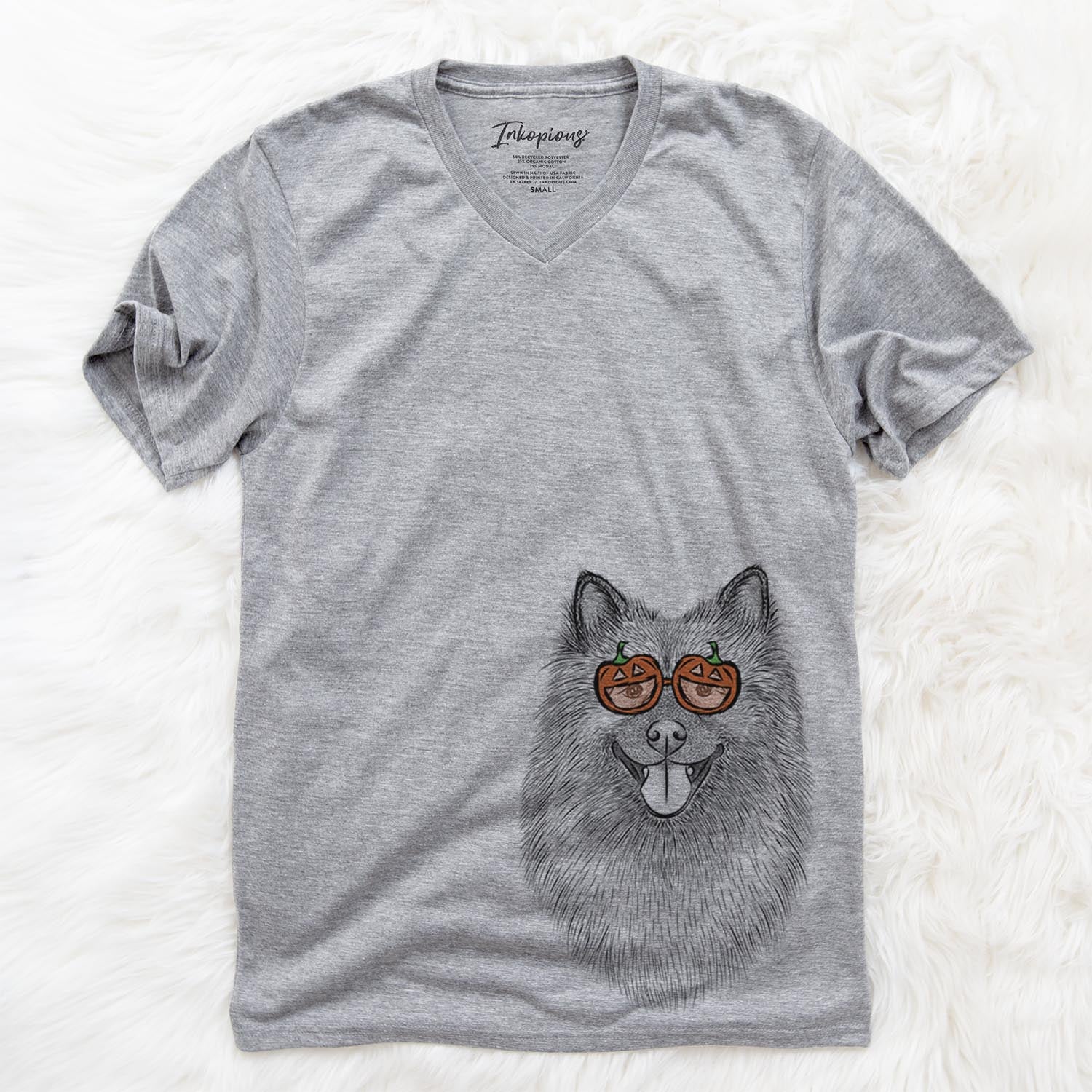 Hand-drawn sketch of Kai the Keeshond wearing pumpkin glasses on a Grey pumpkin collection