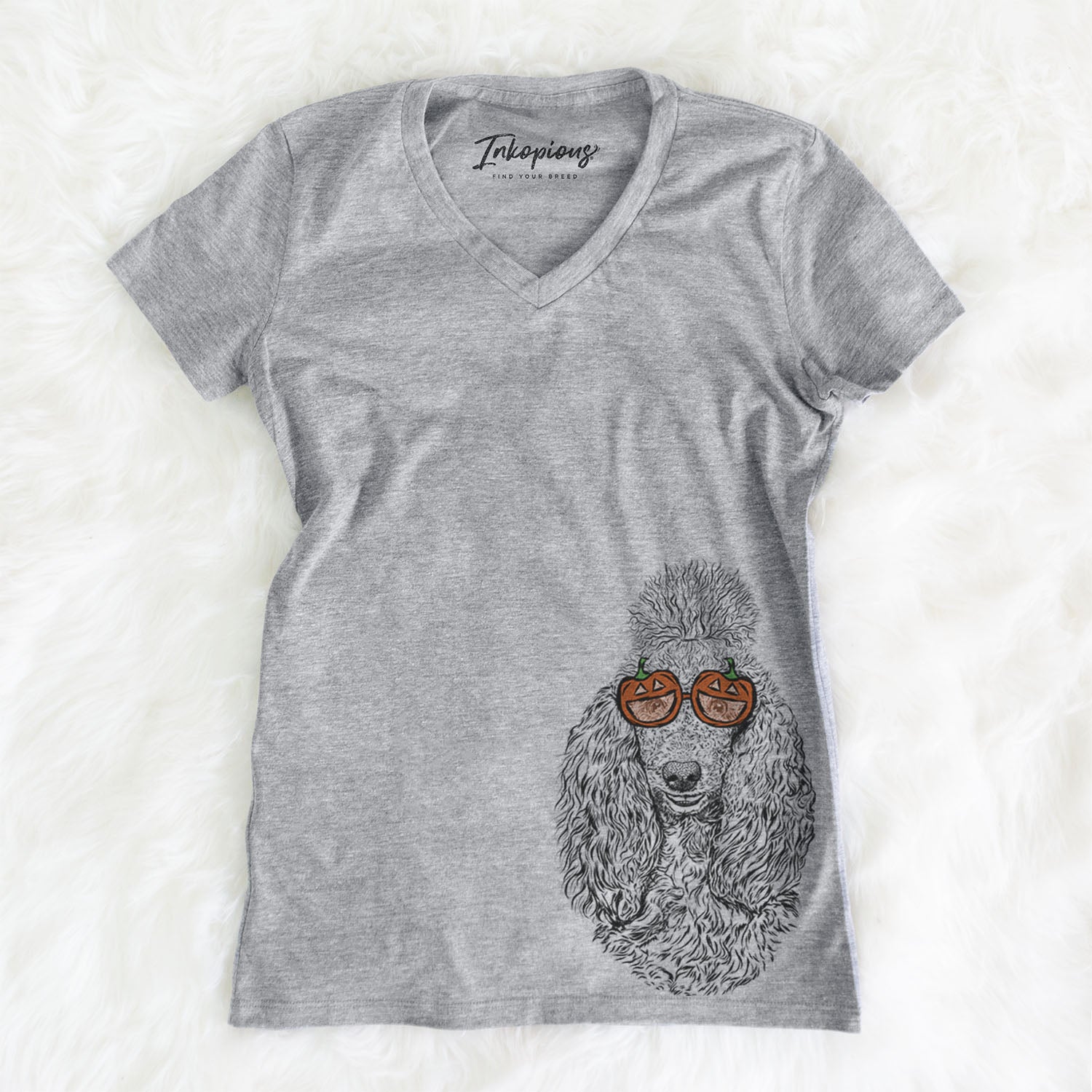 Hand-drawn sketch of Kenna the Poodle wearing pumpkin glasses on a Grey pumpkin collection, on a hanger