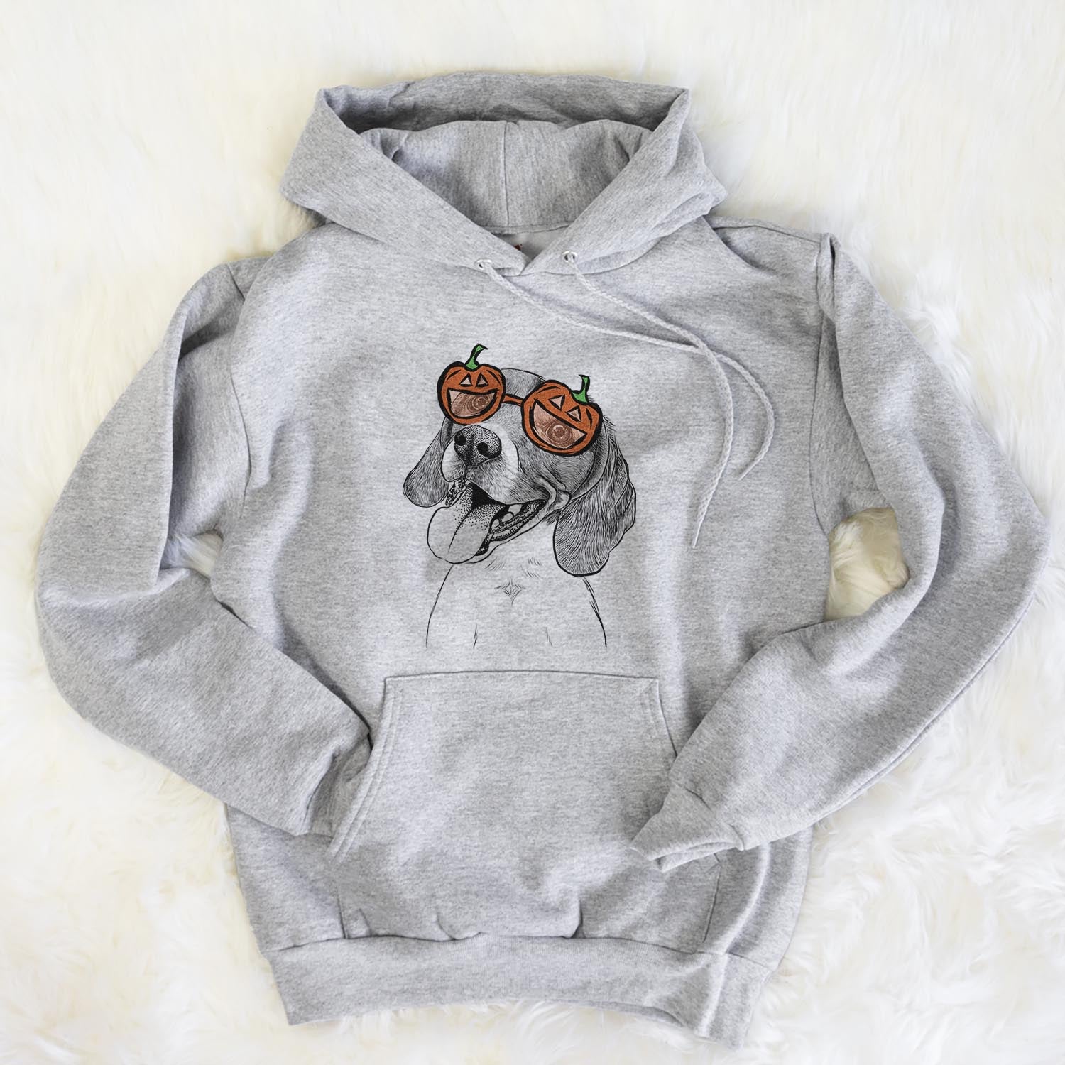 Hand-drawn sketch of Little Bandit the Beagle wearing pumpkin glasses on a Grey pumpkin collection, flat lay