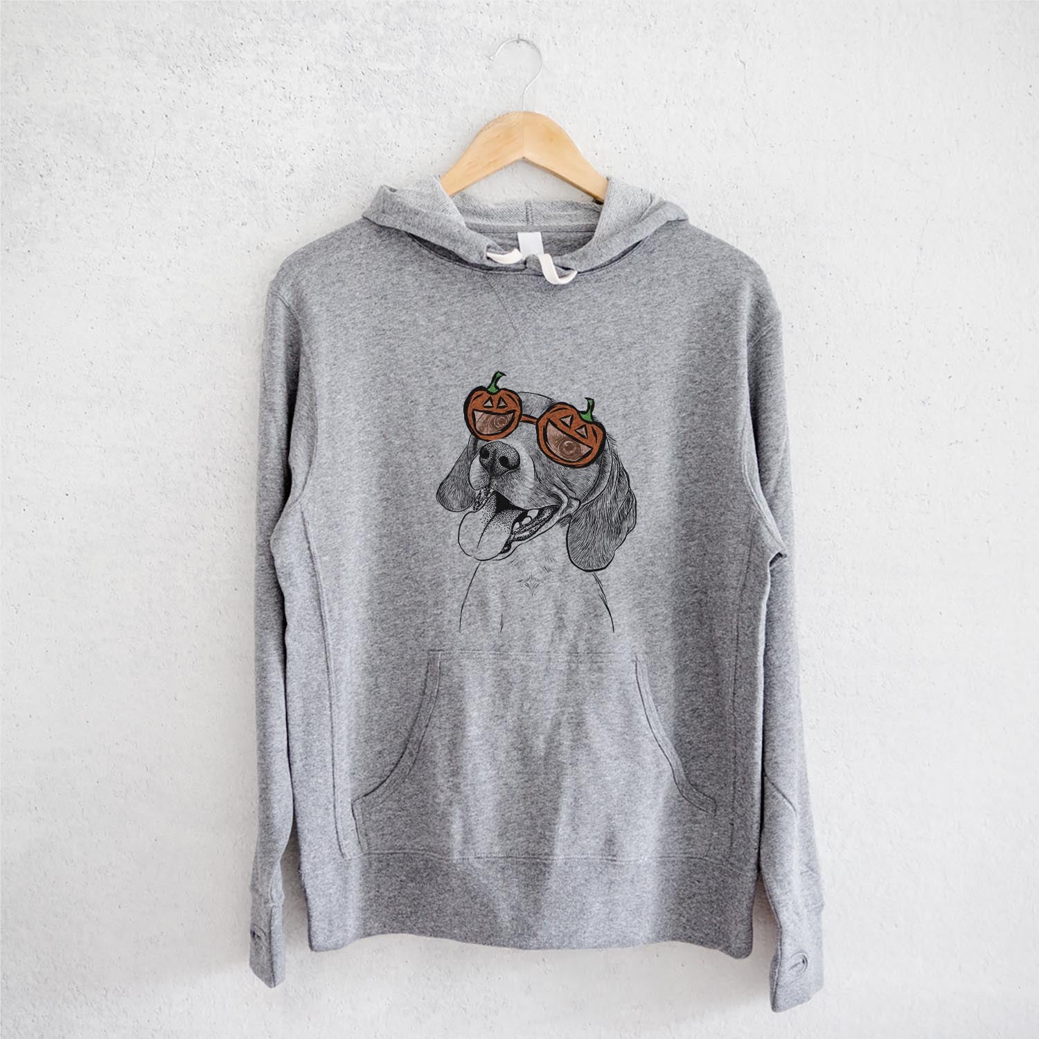 Hand-drawn sketch of Little Bandit the Beagle wearing pumpkin glasses on a Grey pumpkin collection, on a hanger