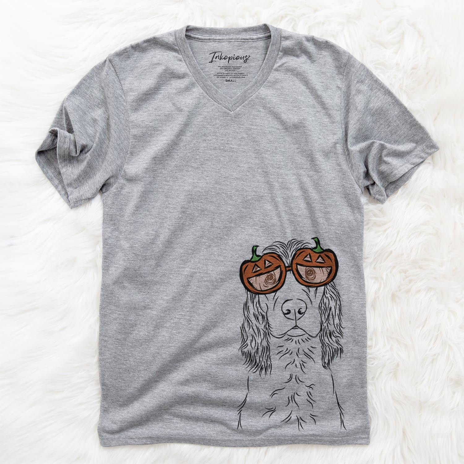 Hand-drawn sketch of Logan the Cocker Spaniel wearing pumpkin glasses on a Grey pumpkin collection