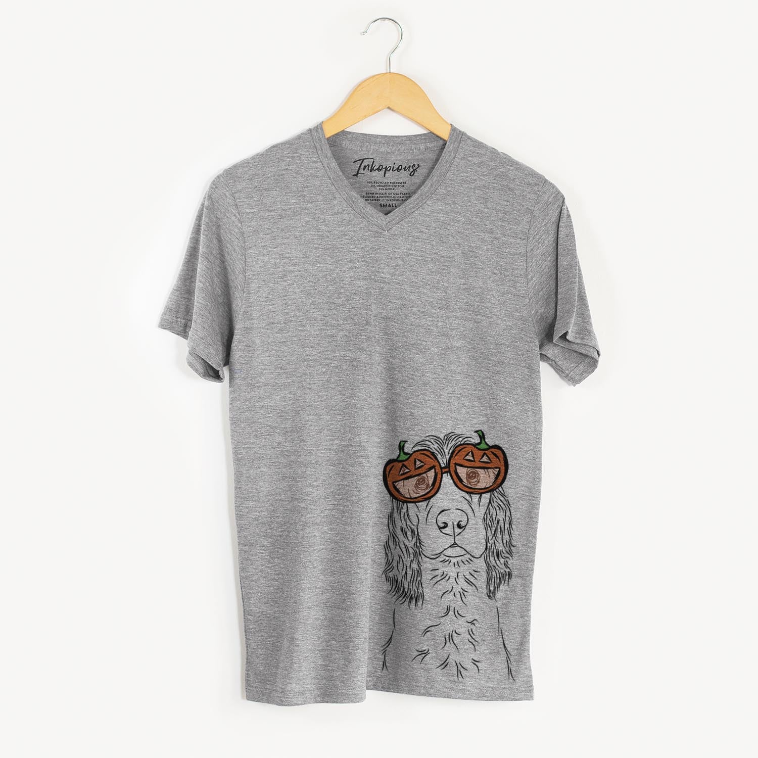 Hand-drawn sketch of Logan the Cocker Spaniel wearing pumpkin glasses on a Grey pumpkin collection