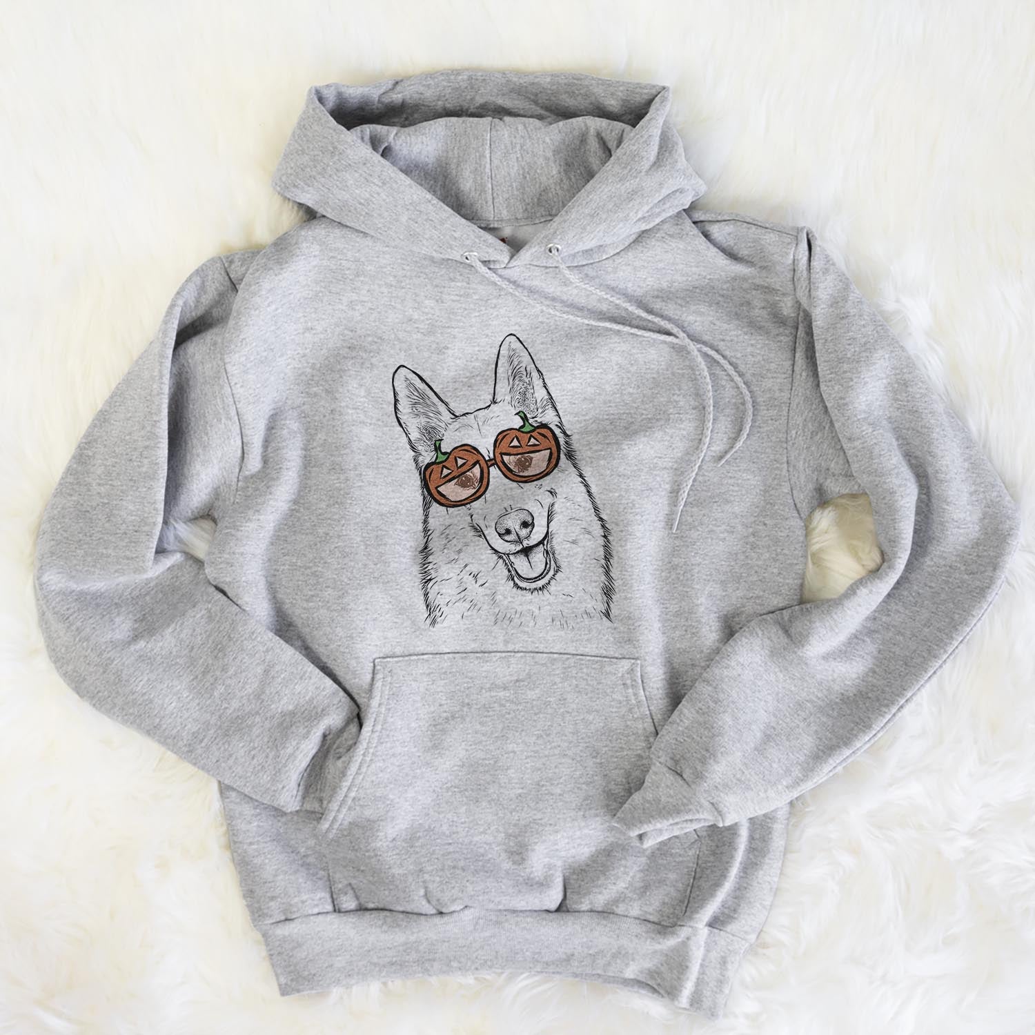Hand-drawn sketch of Loki the Husky Shepherd Mix wearing pumpkin glasses on a Loki Mix pumpkin collection, flat lay