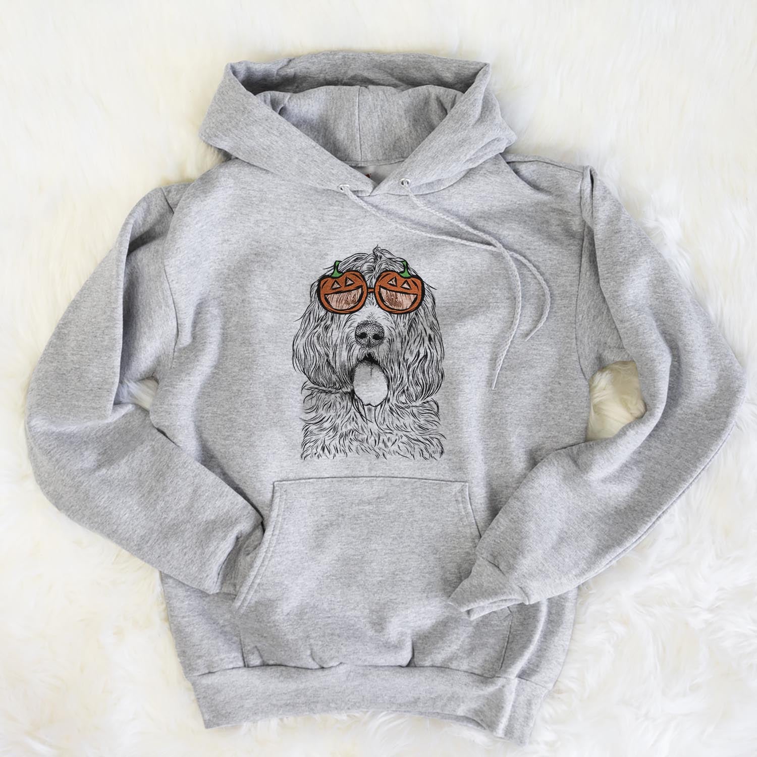 Hand-drawn sketch of Lou the Otterhound wearing pumpkin glasses on a Grey pumpkin collection, flat lay