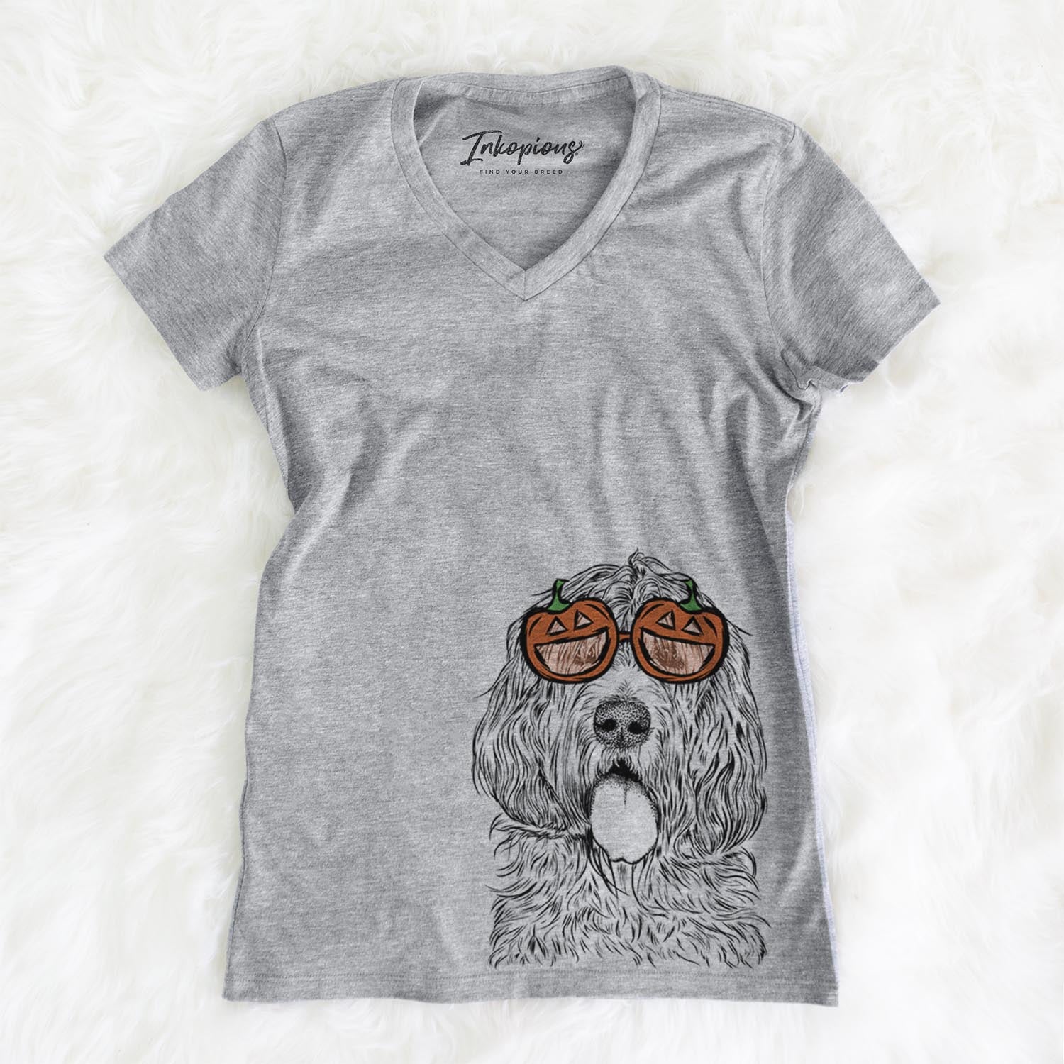 Hand-drawn sketch of Lou the Otterhound wearing pumpkin glasses on a Grey pumpkin collection, on a hanger