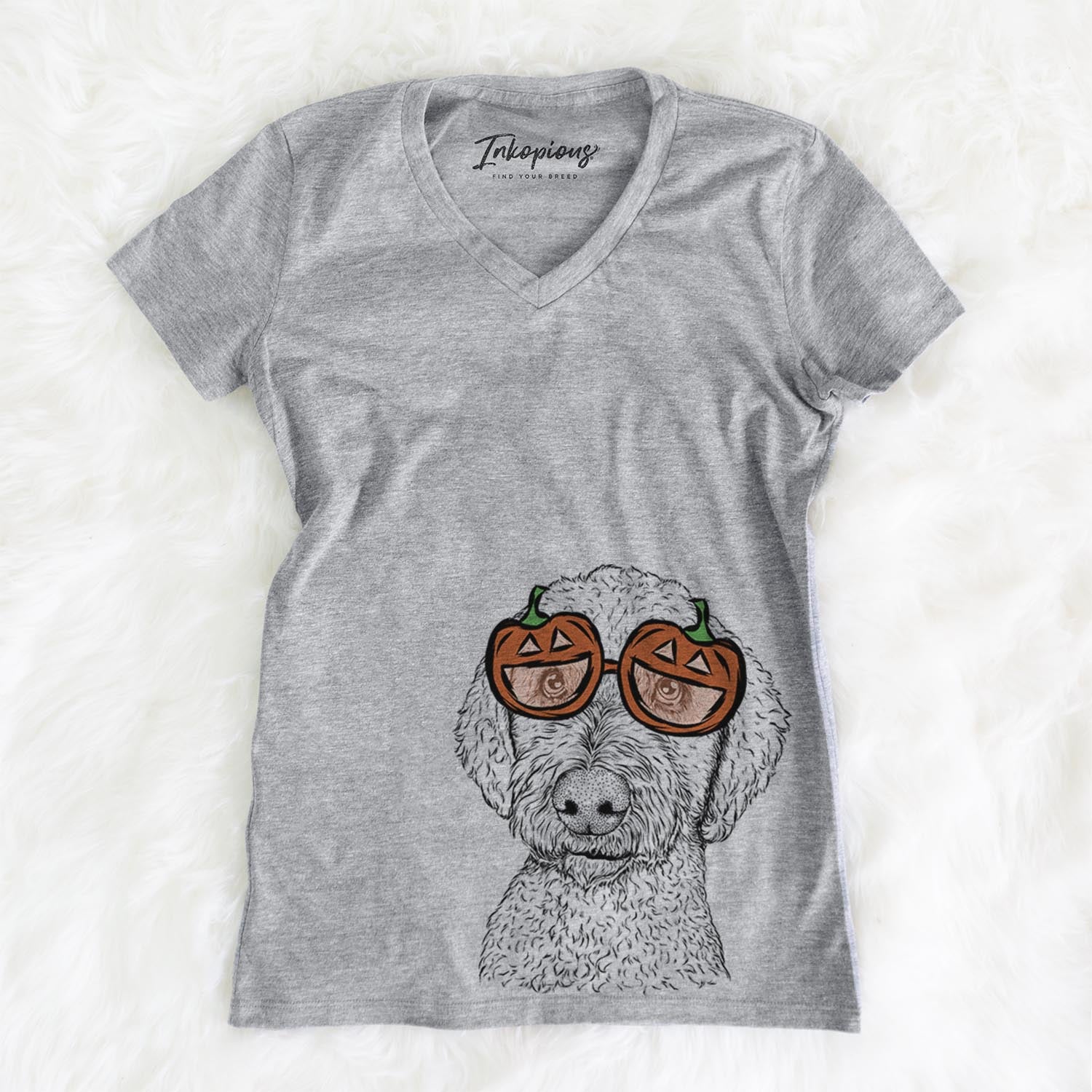 Hand-drawn sketch of Lucy Boo the Goldendoodle wearing pumpkin glasses on a Grey pumpkin collection, on a hanger
