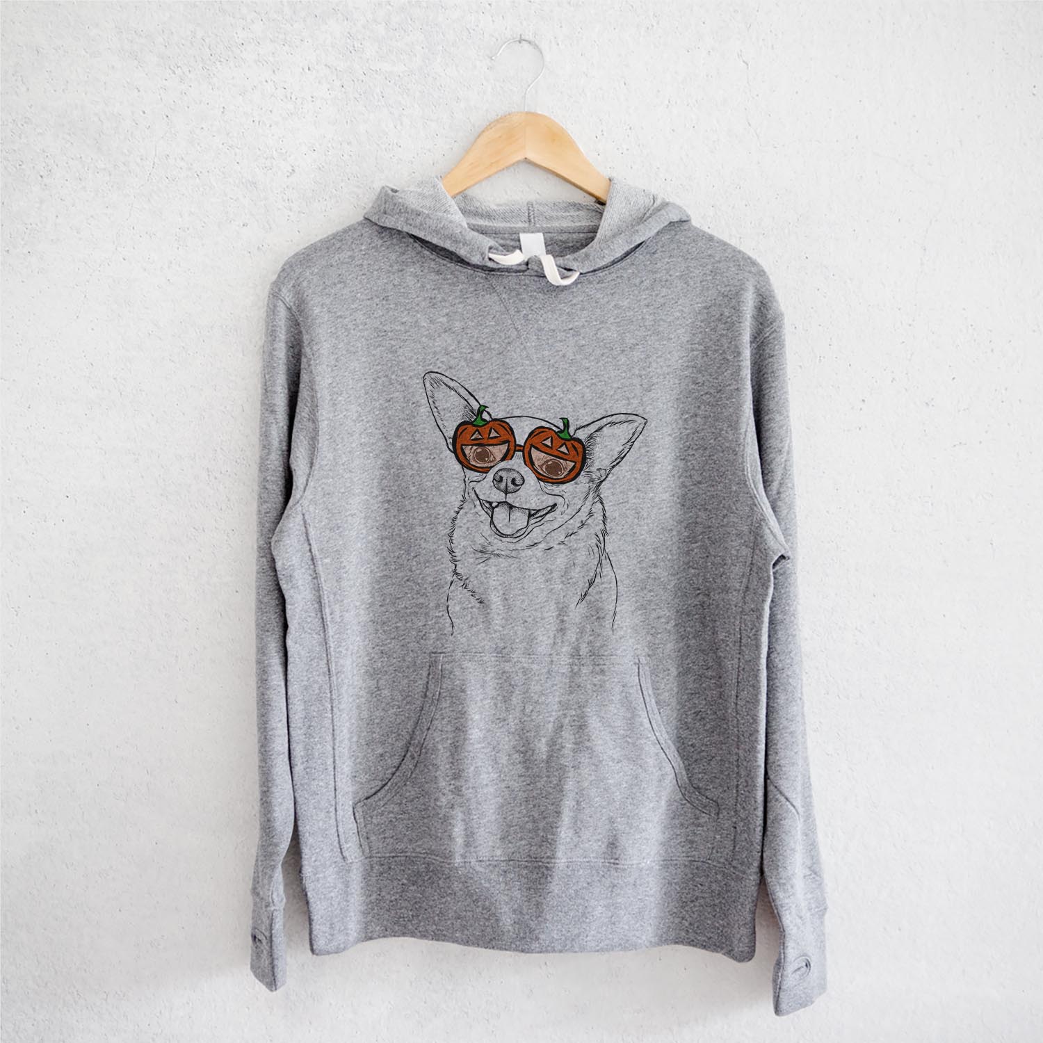 Hand-drawn sketch of Maddison Pearl the Chihuahua wearing pumpkin glasses on a Grey pumpkin collection, on a hanger