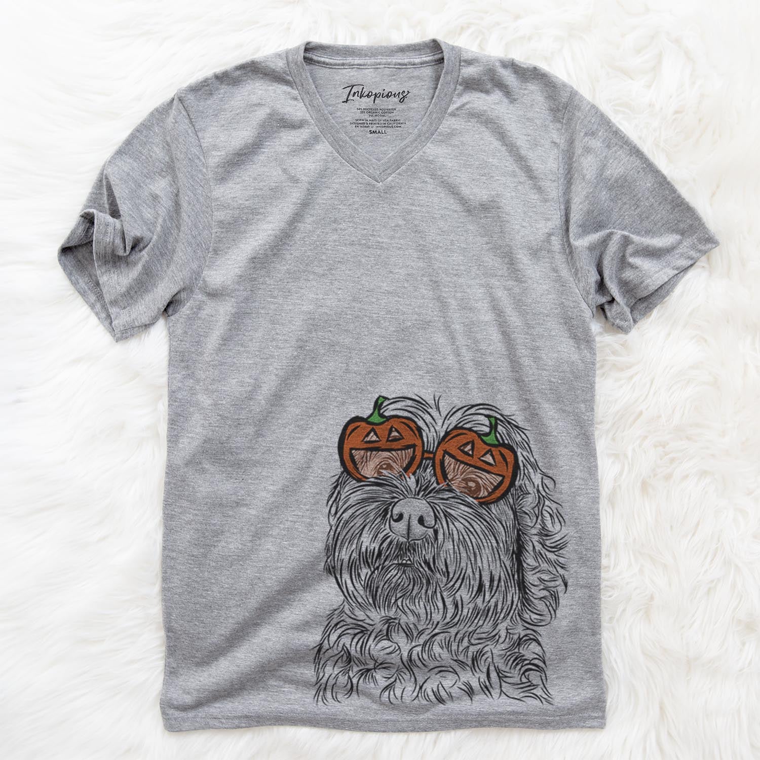 Hand-drawn sketch of Maggie Girl the Cockapoo wearing pumpkin glasses on a Grey pumpkin collection