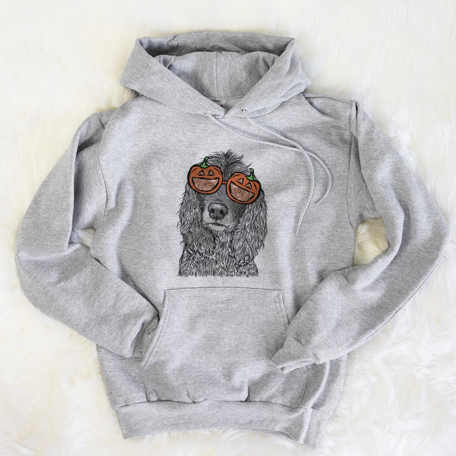 Hand-drawn sketch of Marley Boy the American Cocker Spaniel wearing pumpkin glasses on a Grey pumpkin collection, flat lay