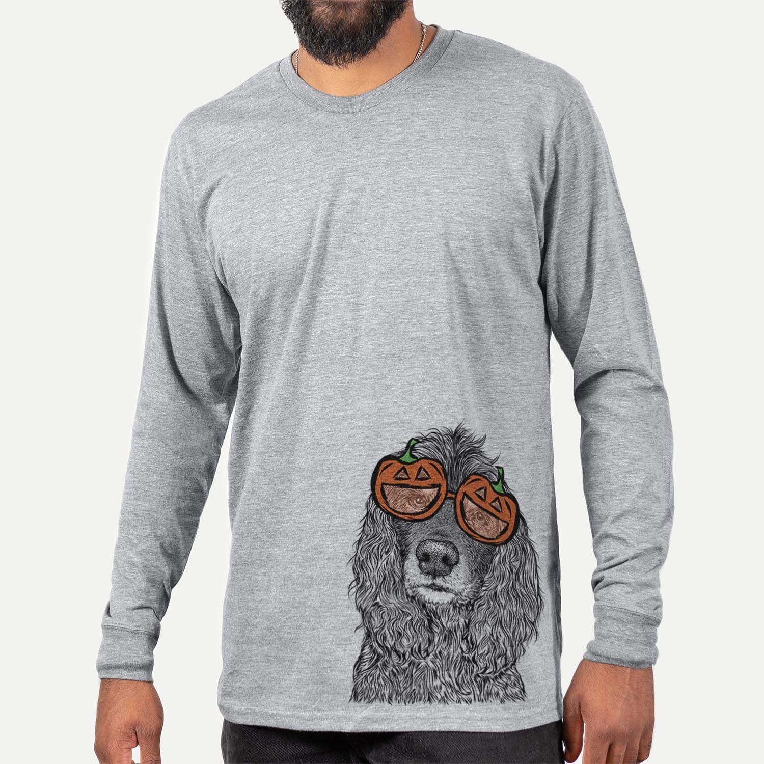 Hand-drawn sketch of Marley Boy the American Cocker Spaniel wearing pumpkin glasses on a Grey pumpkin collection, hanging on a wall