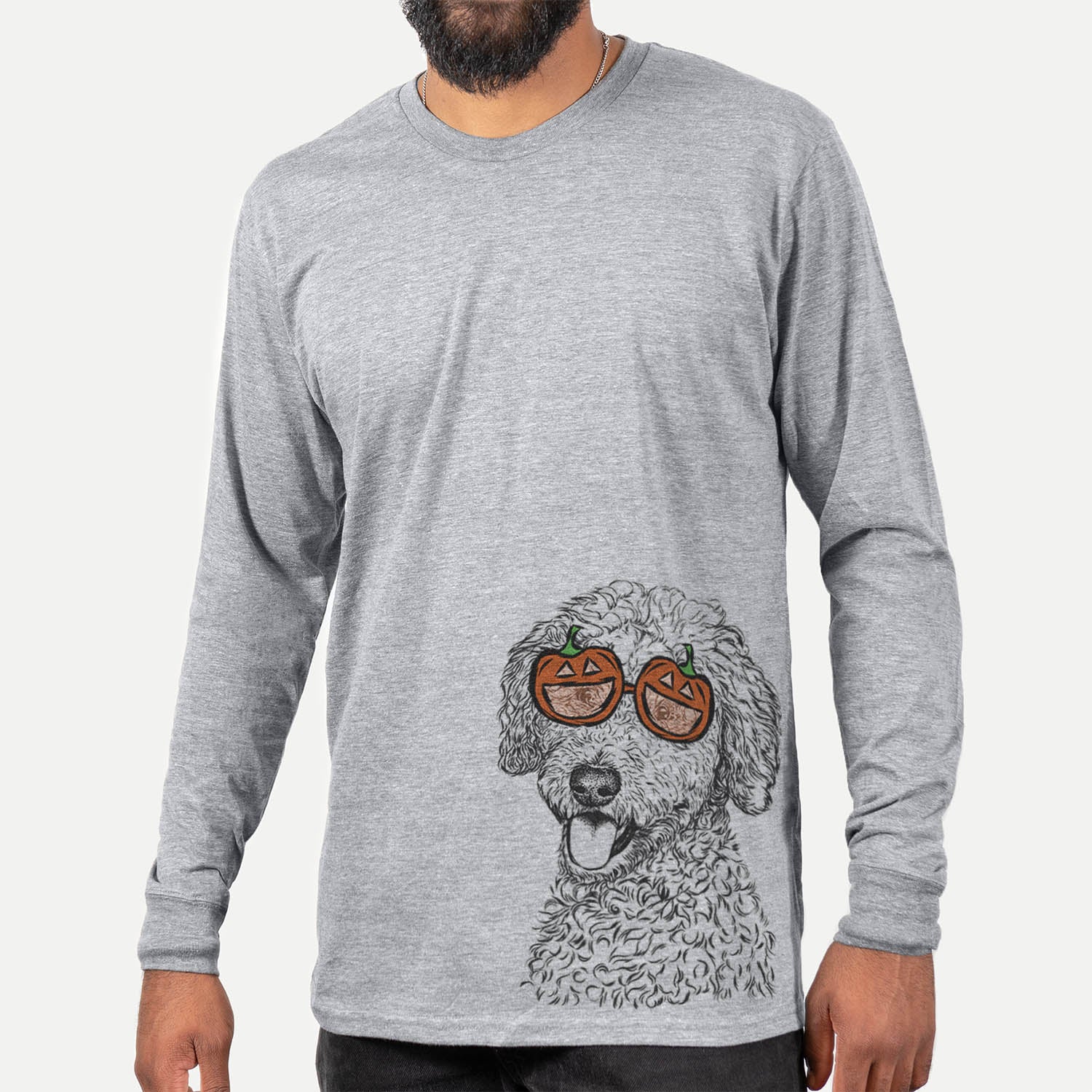 Hand-drawn sketch of Marlow the Goldendoodle wearing pumpkin glasses on a Marlow Doodle pumpkin collection, hanging on a wall
