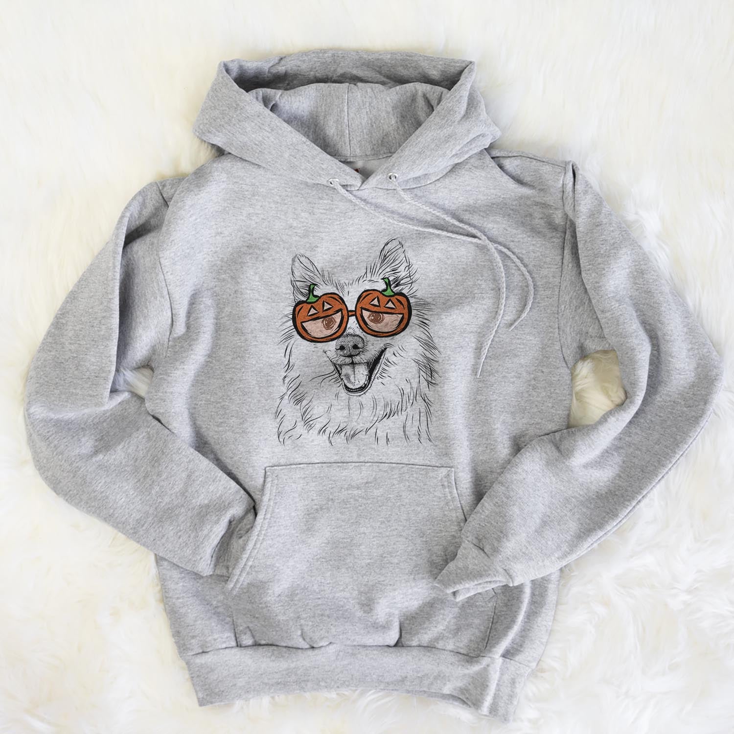 Hand-drawn sketch of Miki the American Eskimo wearing pumpkin glasses on a Grey pumpkin collection, flat lay