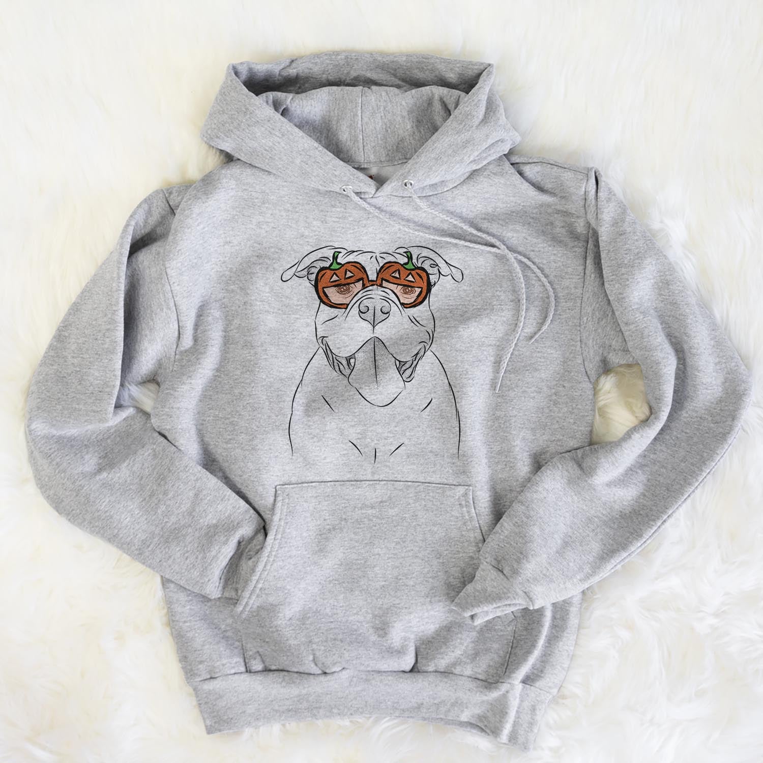 Hand-drawn sketch of Nacho the American Bully wearing pumpkin glasses on a Grey pumpkin collection, flat lay